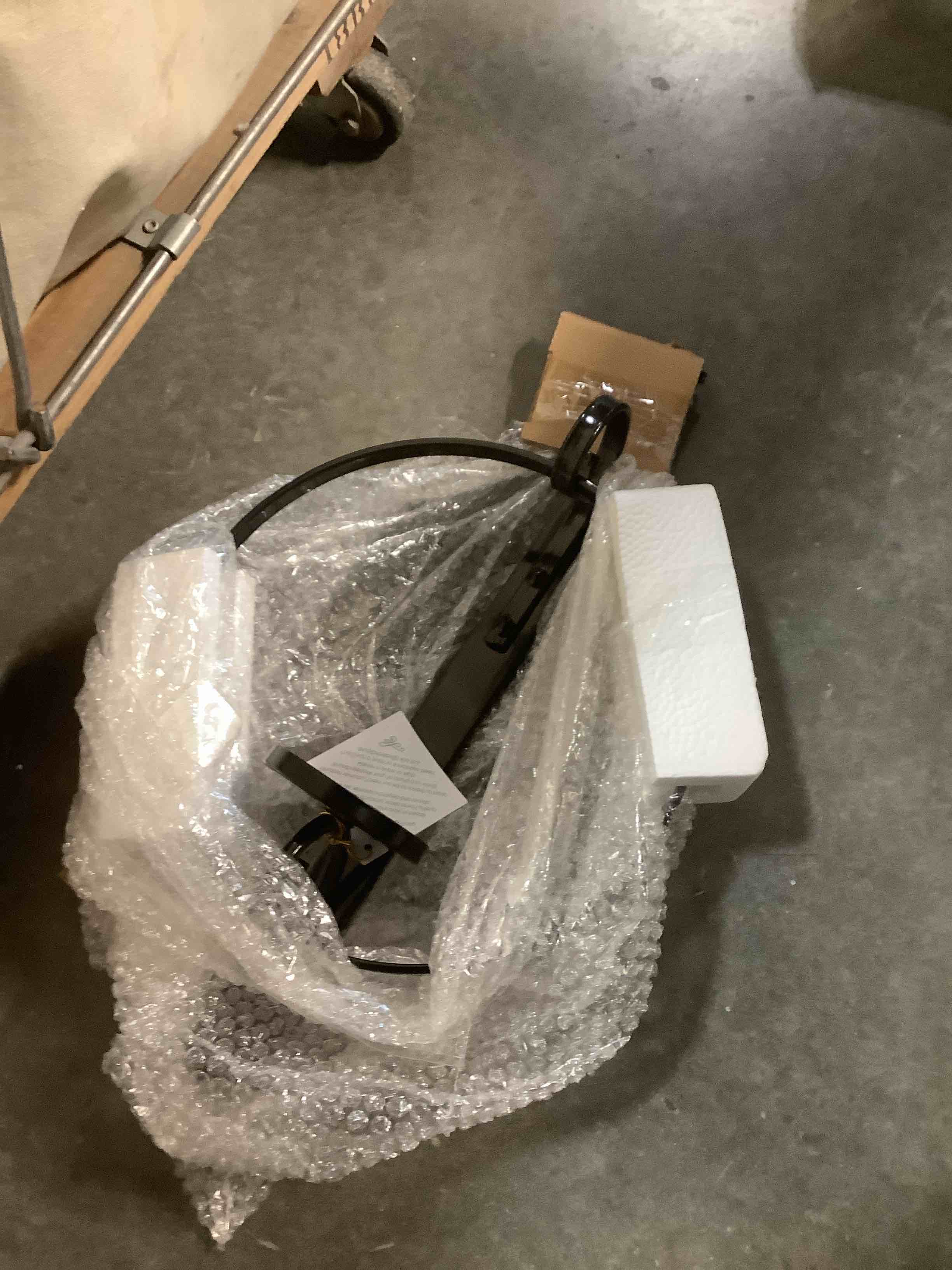 Condition photo showing As Is for Kate and Laurel Doria Metal Wall Candle Holder Sconce, Black