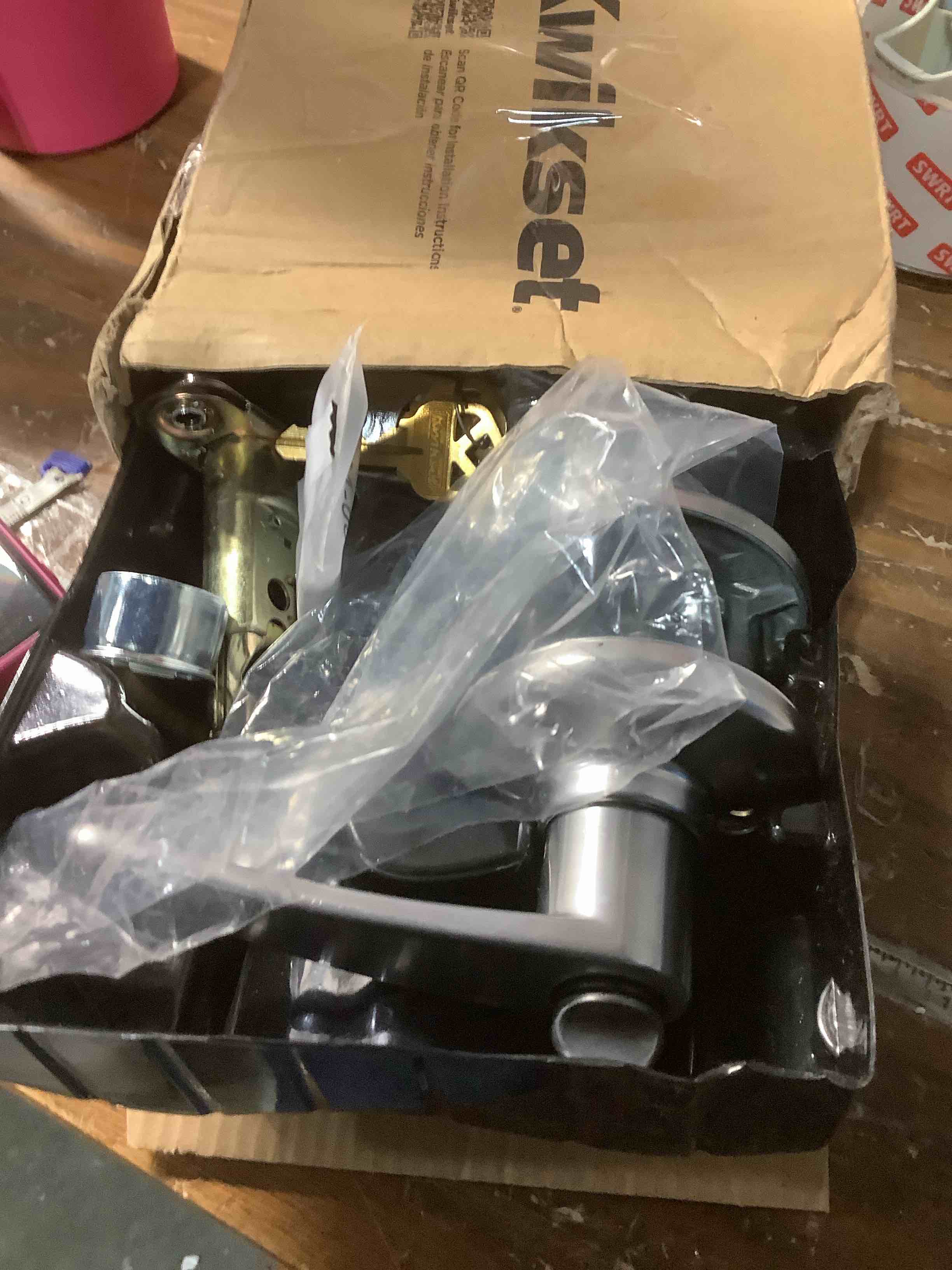 Condition photo showing As Is for Kwikset Delta Entry Door Handle with Lock and Key, Secure Keyed Reversible Lever Exterior, Doorlock, For Front Entrance and Bedrooms, Satin Chrome, Pick Resistant Smartkey Rekey Security