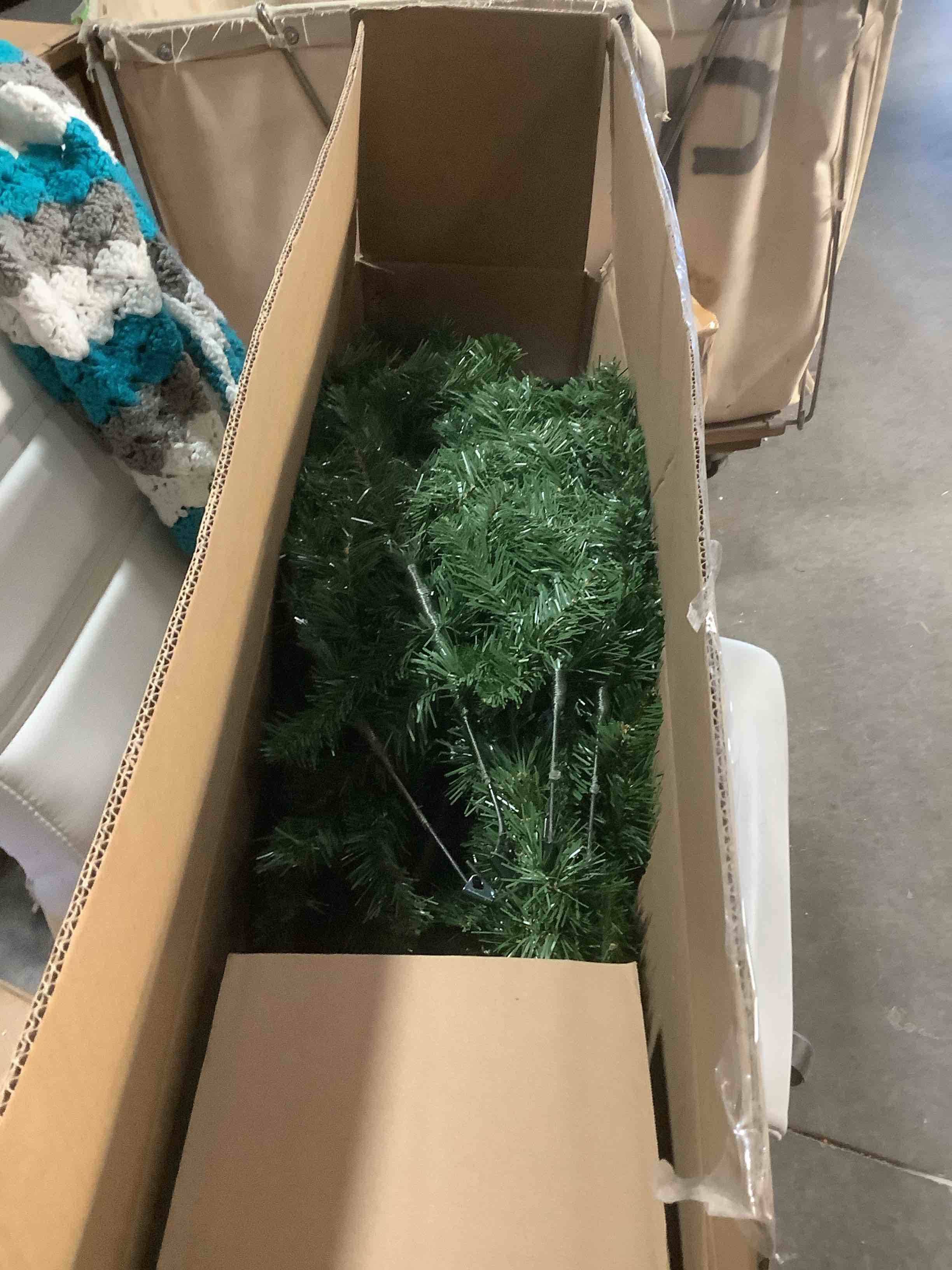 Condition photo showing Good Condition for National Tree Company 6.5 ft Unlit North Valley Spruce Slim Artificial Christmas Tree, 832 Tips, Includes Stand, Green