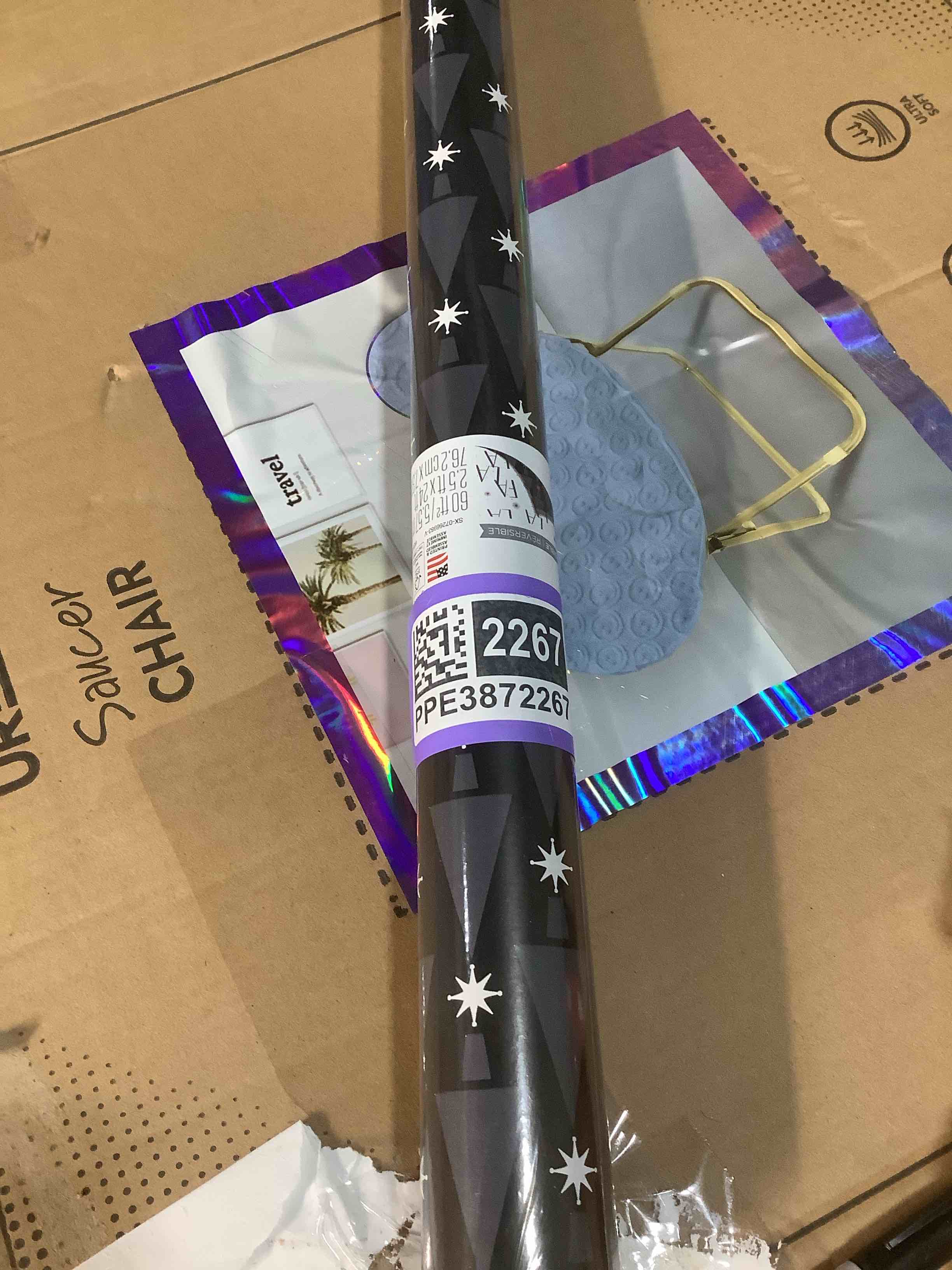Condition photo showing New/Like New for American Greetings Reversible Modern Black Christmas Wrapping Paper Roll, White, Silver, and Black Holiday Gift Wrap (60 sq. ft., 1 Standard Roll Wrap-30 in. x 24 ft.) Fa La La and Trees Modern Black and Silver