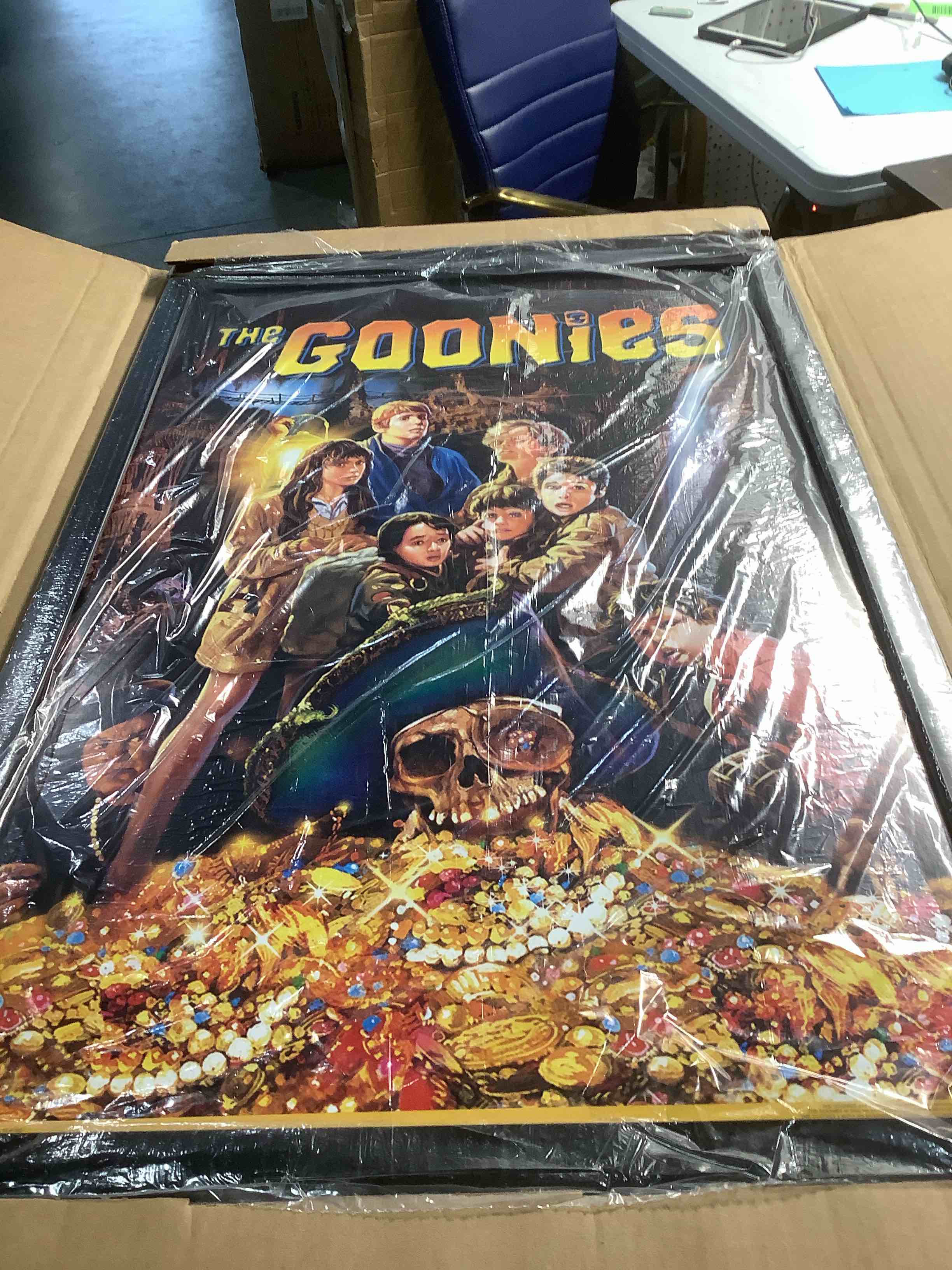 Condition photo showing As Is for Trends International The Goonies - One Sheet Wall Poster, 22.375" x 34", Black Framed Version Black Framed Version 34"L x 22.4"W