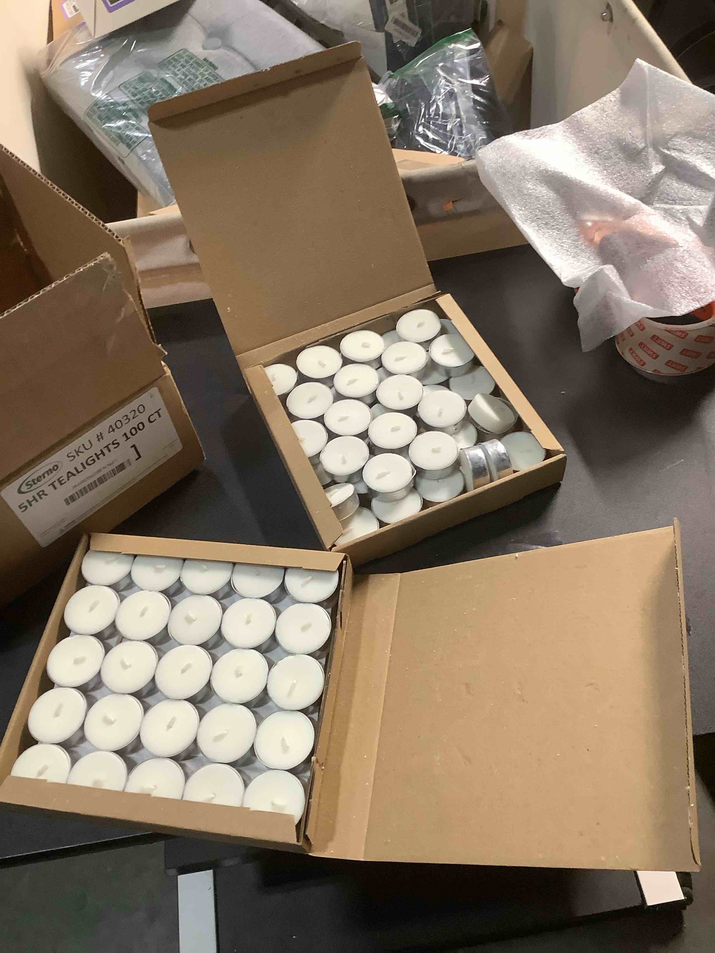 Condition photo showing Good Condition for Sterno 100-Pack Tea Lights Candles Bulk Pack - Long Lasting Tealight, Burns Up to 5 Hours - Unscented White Candles for Indoors or Outdoors - Use as Party Decor or Centerpiece Table Decorations