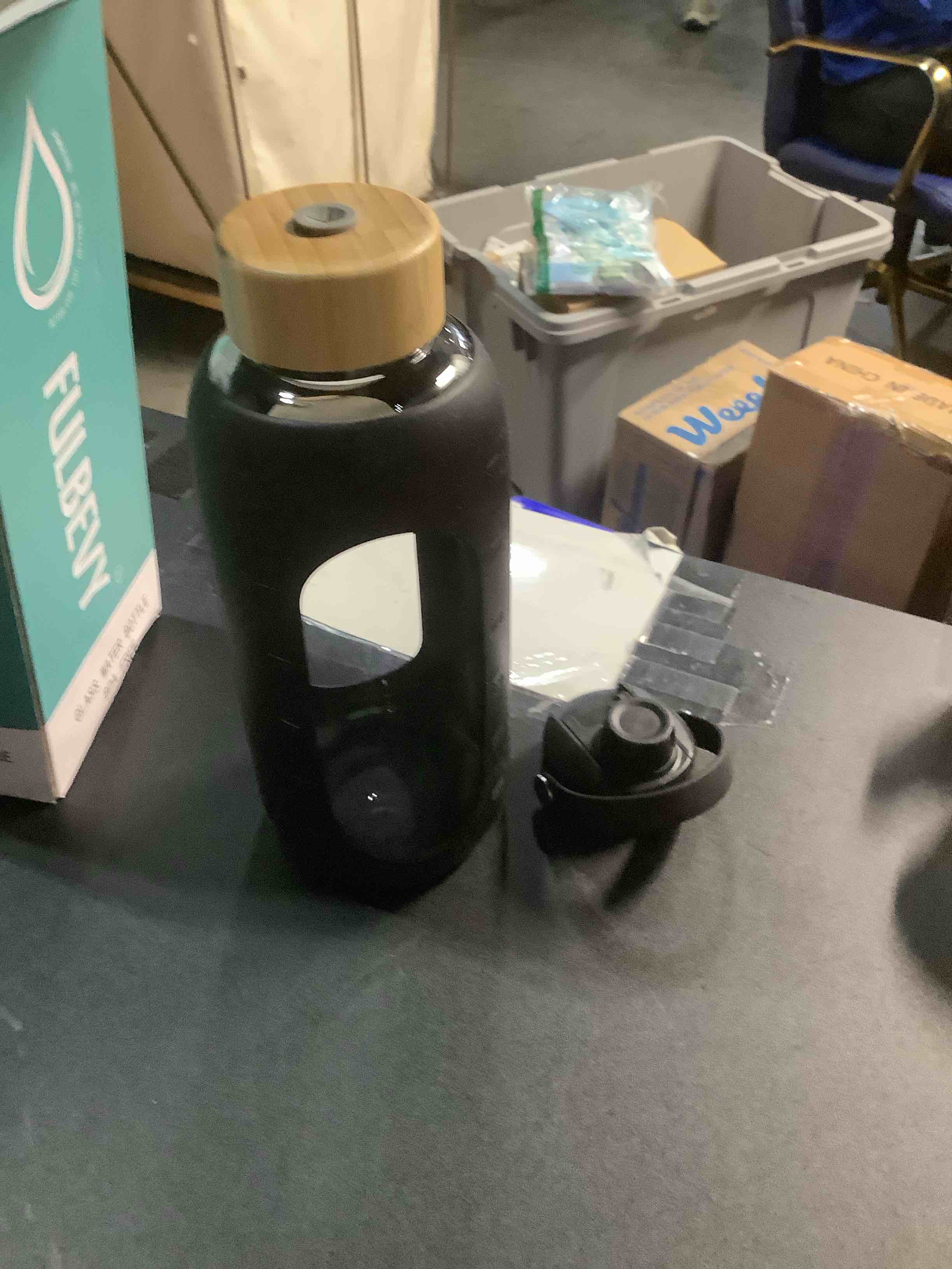 Condition photo showing Good Condition for Glass Water Bottles 64 oz - Half Gallon Large Motivational Daily Water Intake Bottle Time Marker - Glass Water Bottle With Straw, Silicone Sleeve 2 Lids, Handle Spout & Bamboo Lid(Black) 64 Ounces Black