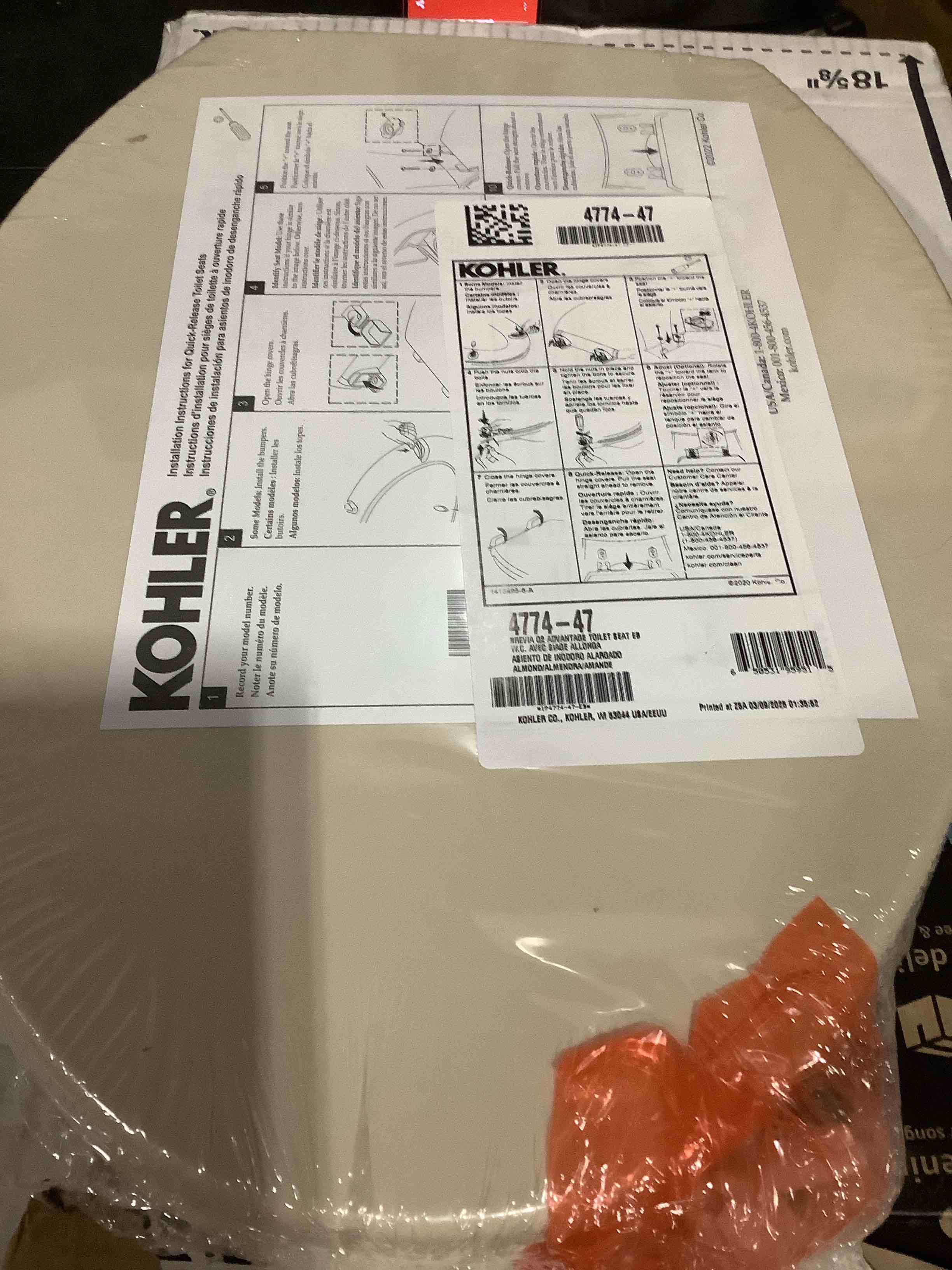 Condition photo showing New/Like New for kohler k-4774-47 brevia elongated toilet seat with quick-release hinges and quick-attach hardware for easy clean, almond elongated almond