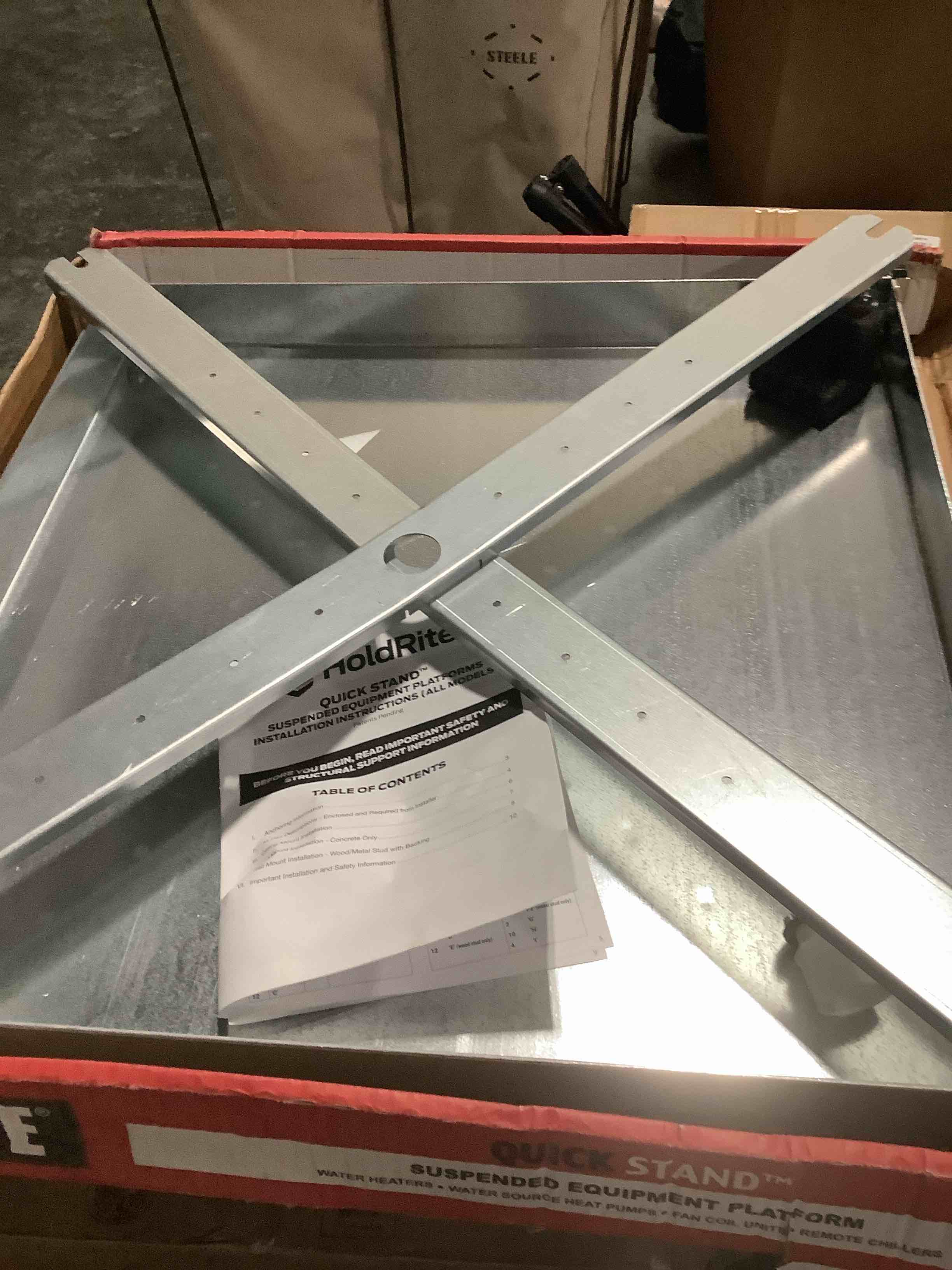 Condition photo showing As Is for holdrite quickstand 26-1/2 inch wall mounted water heater platform, up to 50 gallons, pvc drain fitting, hanging, 50-swhp-w 26-1/2 in.
