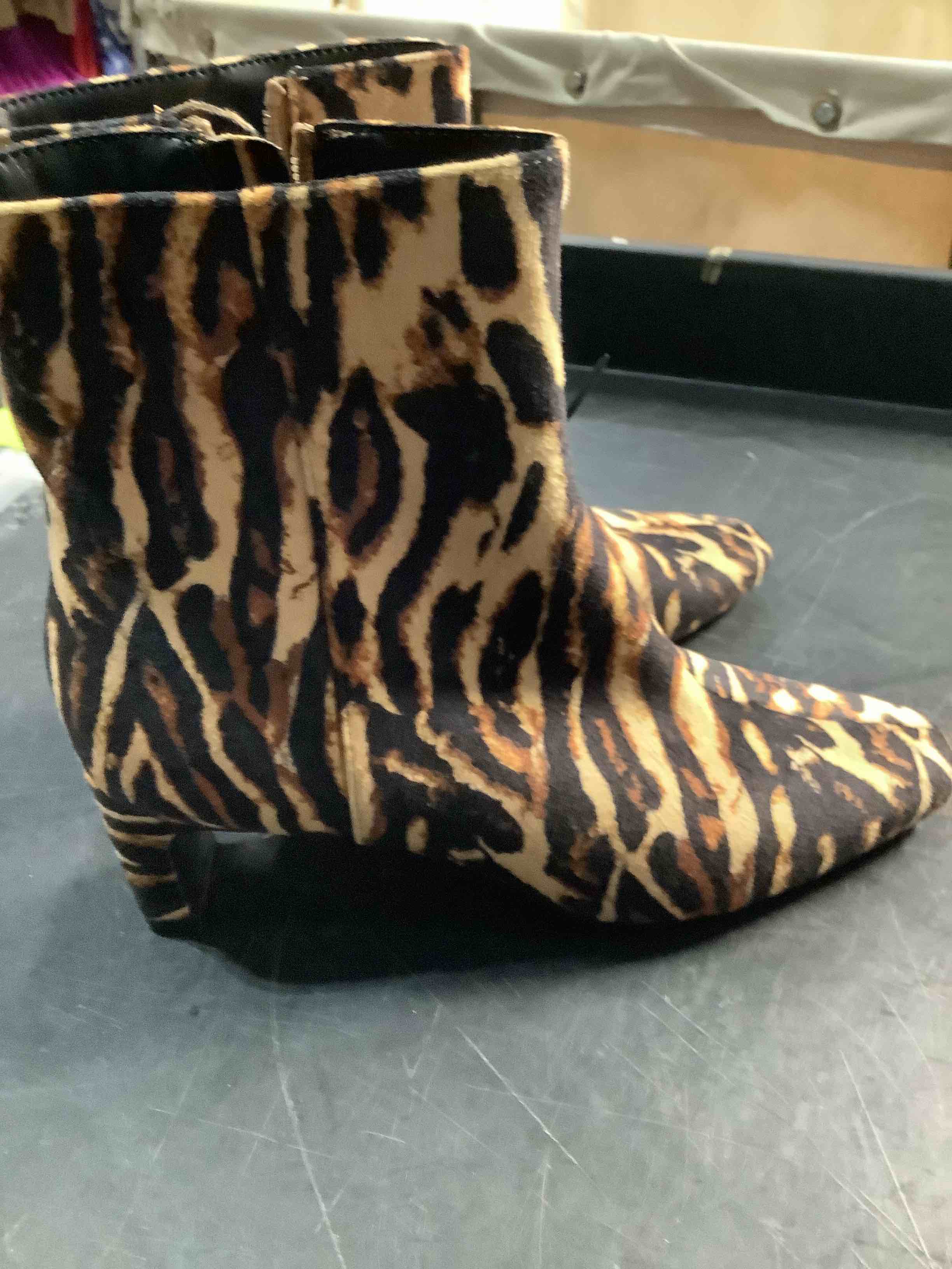 Condition photo showing New/Like New for a new day, short boots, animal, print size 6