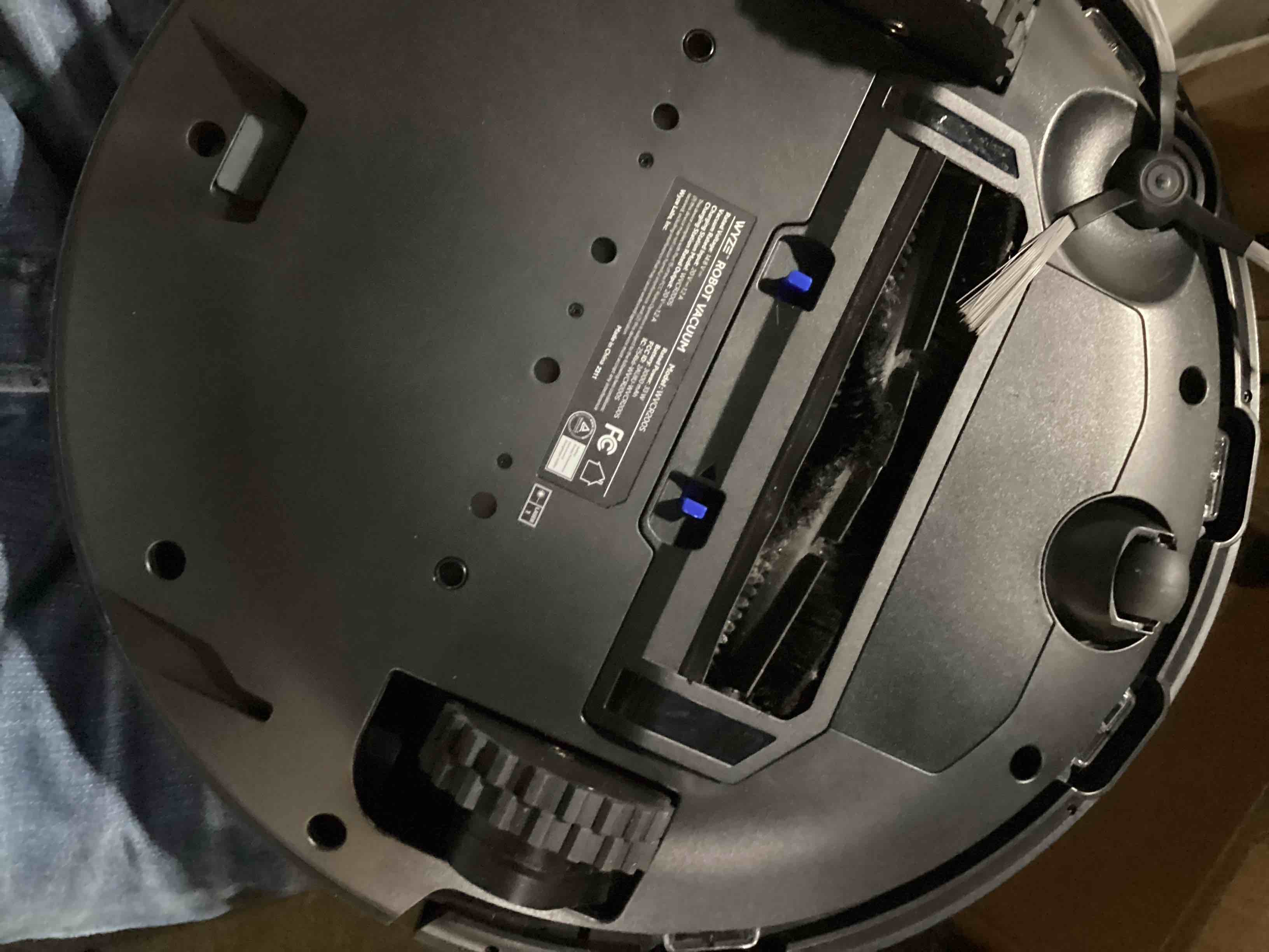 Condition photo showing As Is for wyze robot vacuum