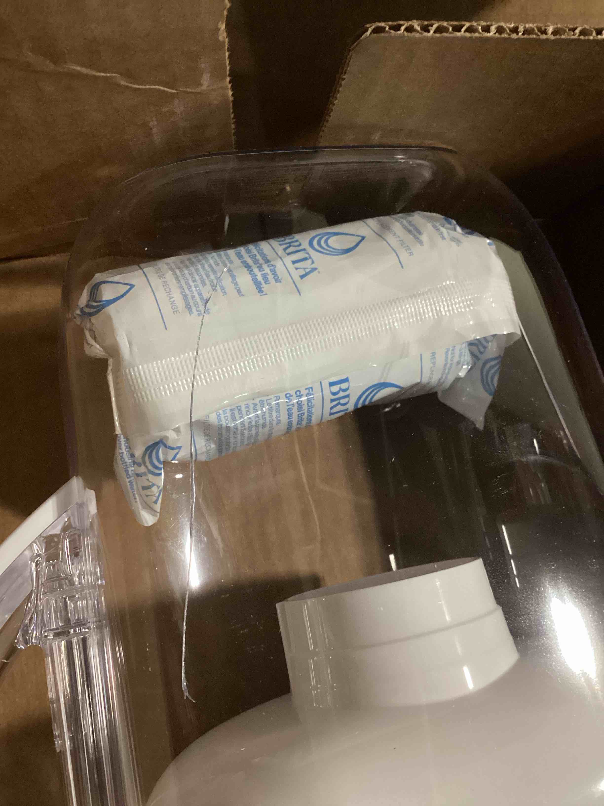 Condition photo showing As Is for crack in pitcher brita metro water filter pitcher with smartlight change indicator, bpa-free, replaces 1,800 plastic water bottles a year, lasts two months, includes 1 filter, small - 6-cup capacity, white original white
