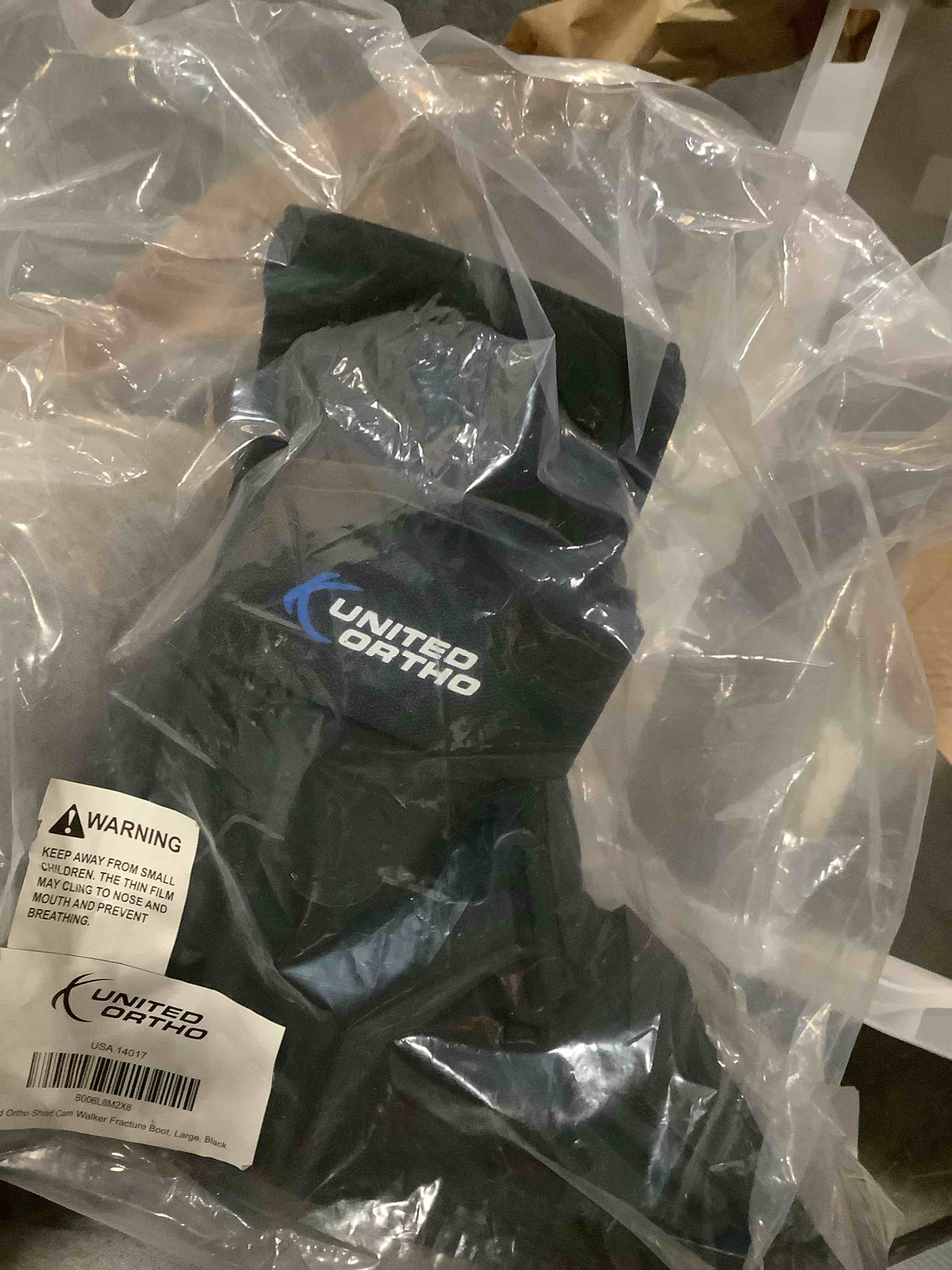 Condition photo showing New/Like New for United Ortho Short Cam Walker Fracture Boot, Large, Black Large Shoe Black