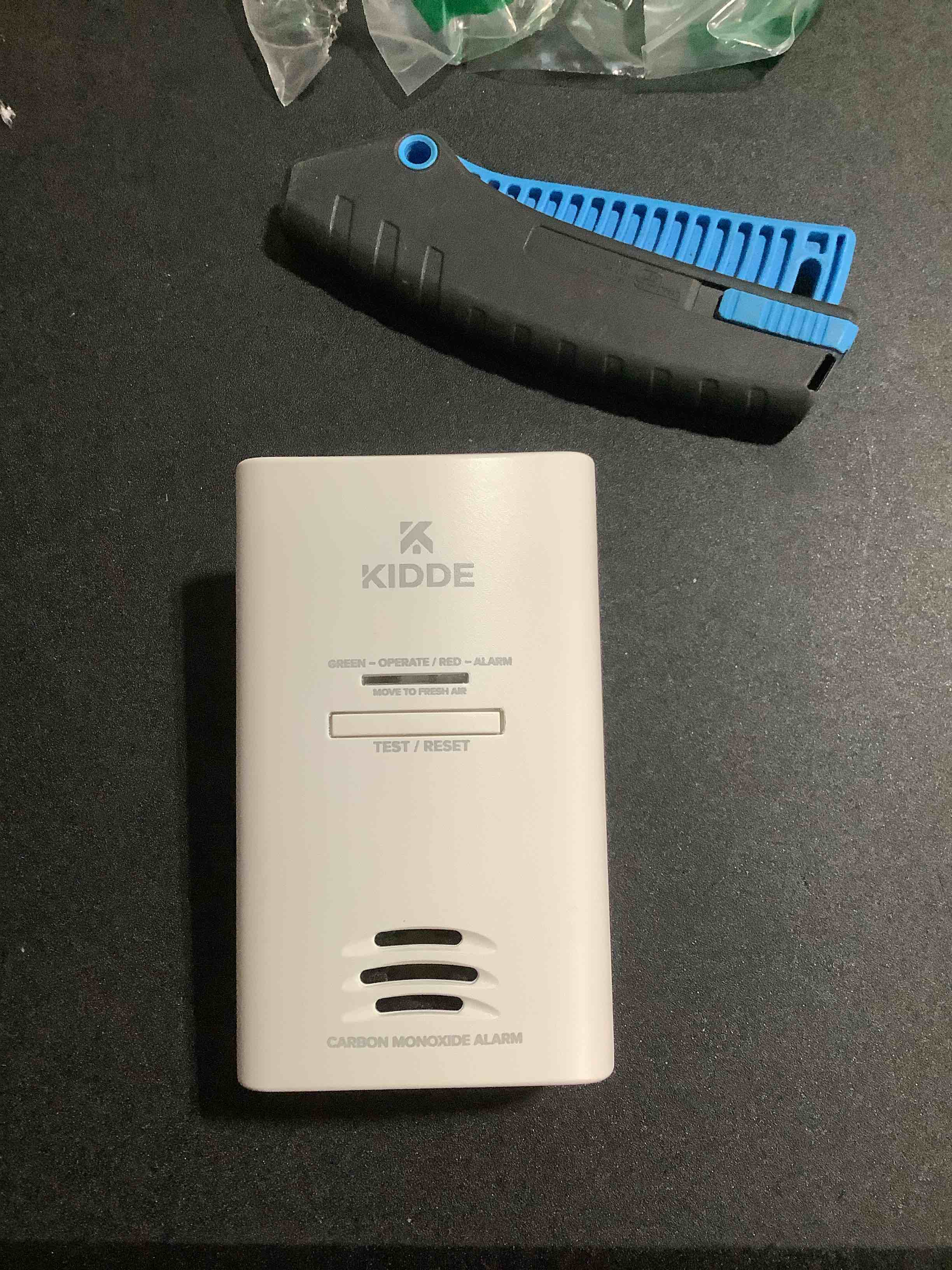 Condition photo showing As Is for Kidde Carbon Monoxide Detector, Plug in Wall with AA Battery Backup, Test-Hush Button