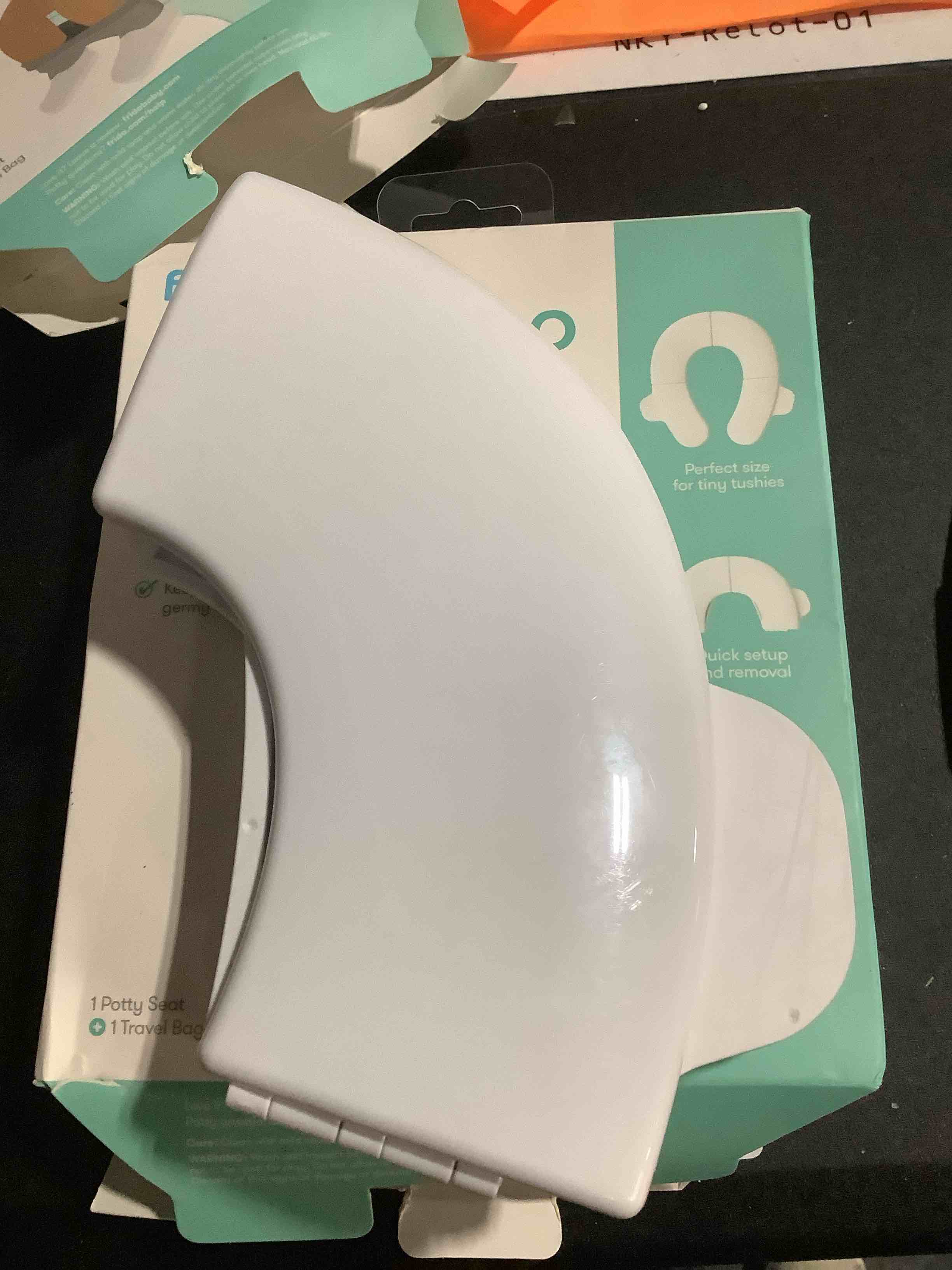 Condition photo showing Good Condition for Frida Baby Fold-and-Go Portable Potty Seat for Toilet, Foldable Travel Potty Seat for Toddler, Fits Round & Oval Toilets, Non-Slip Base, Handles, Includes Free Travel Bag Small