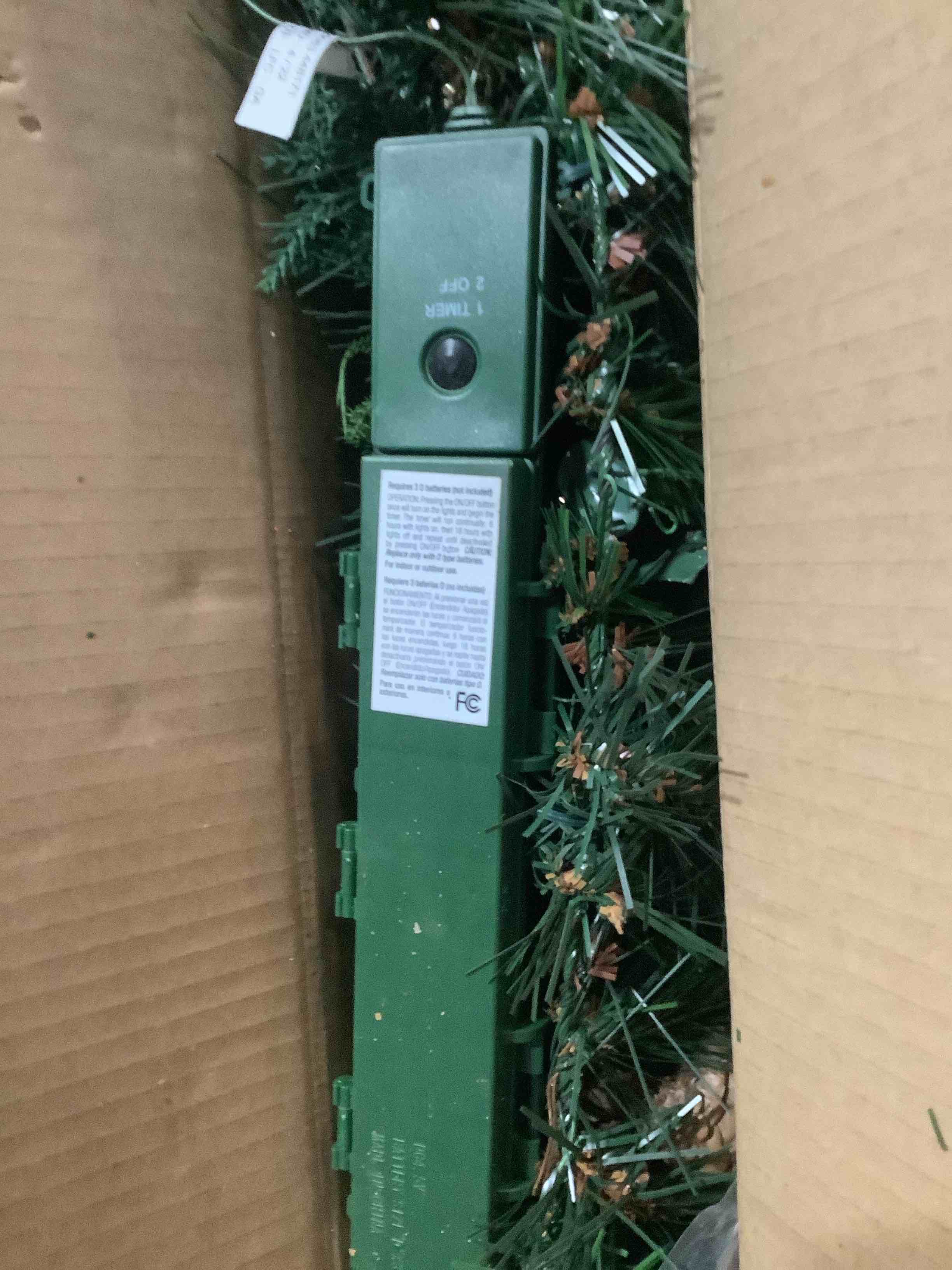 Condition photo showing Good Condition for National Tree Company 9 ft Pre-Lit Artificial North Conway Christmas Garland, Christmas Decoration with Glittery Edged Pinecones, Glittery Eucalyptus, 100 Warm White LED Lights, Timer