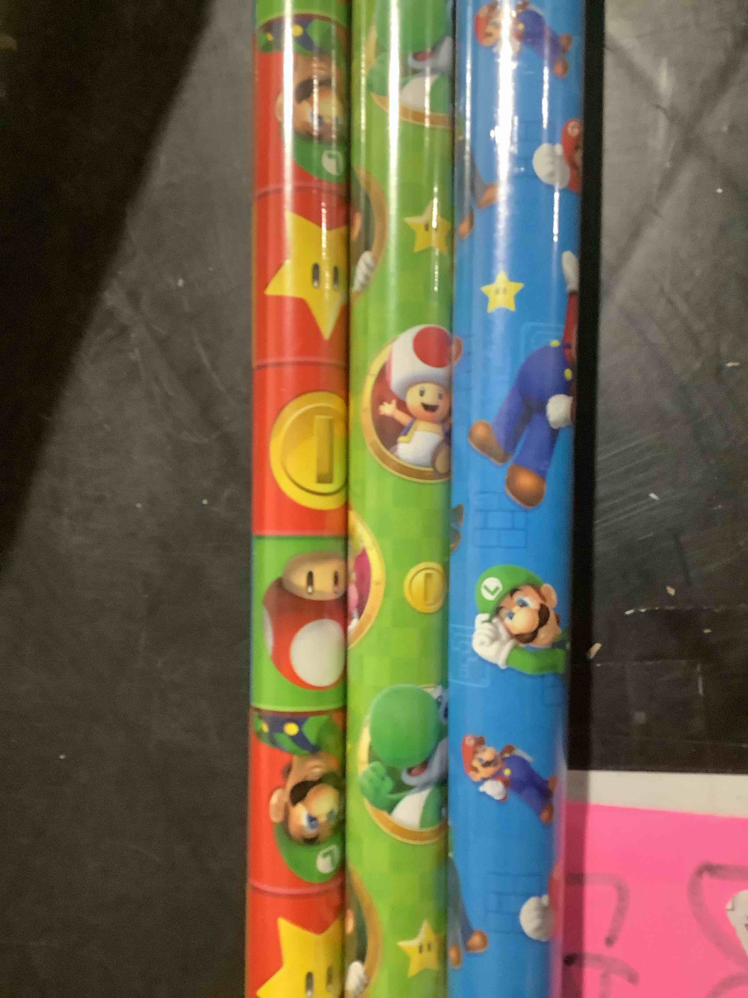 Condition photo showing Good Condition for Hallmark Nintendo Super Mario Wrapping Paper Rolls for Kids with Cutlines on Reverse (3 Rolls: 60 Sq. Ft. Total) Mario, Luigi, Yoshi, Bowser, Princess Peach, Toad