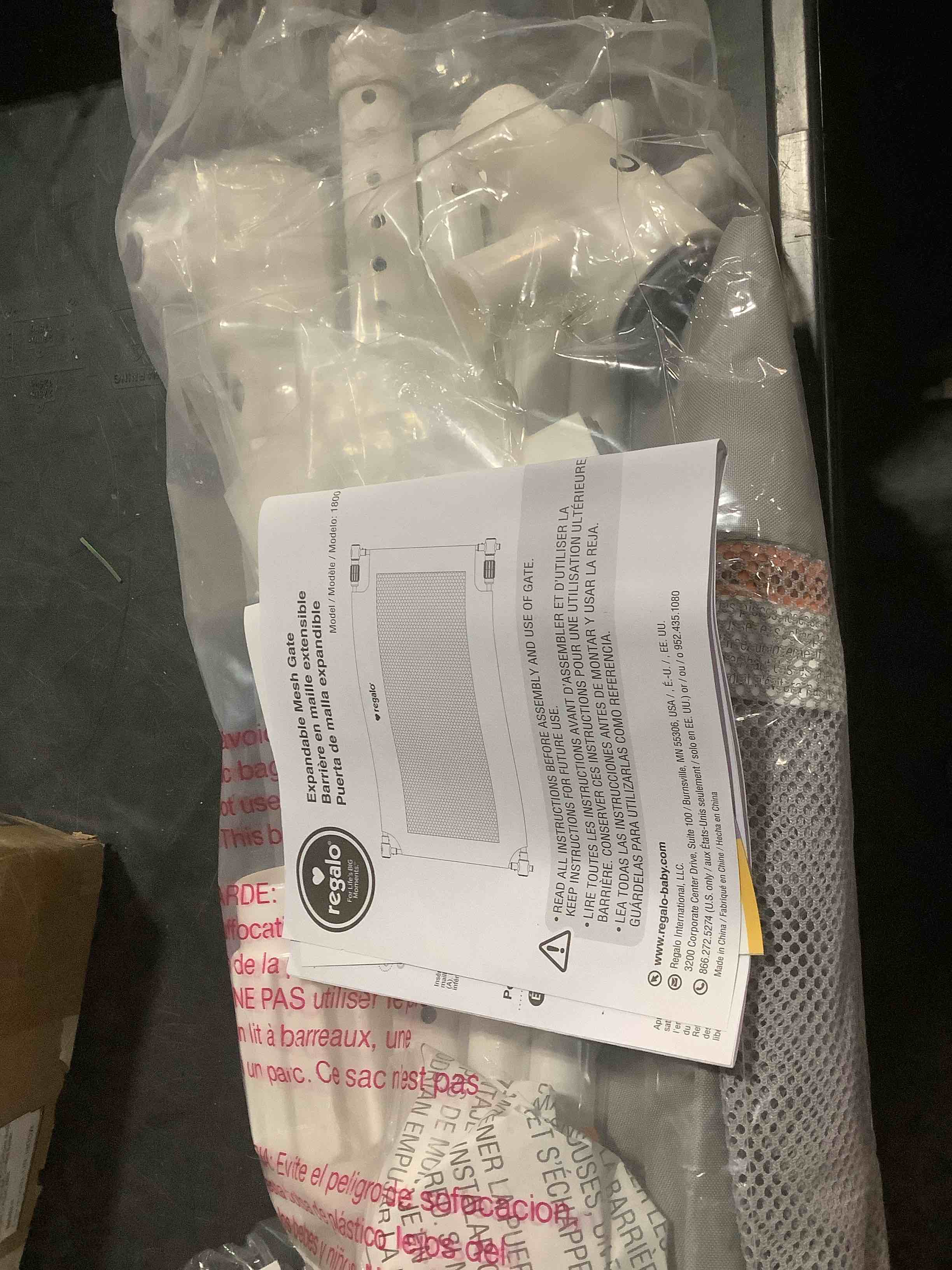 Condition photo showing As Is for Regalo 50" Extra Wide Gray Expandable Mesh Gate, Pressure Mounted, Includes Rubber Bumpers to Protect Walls, Gray