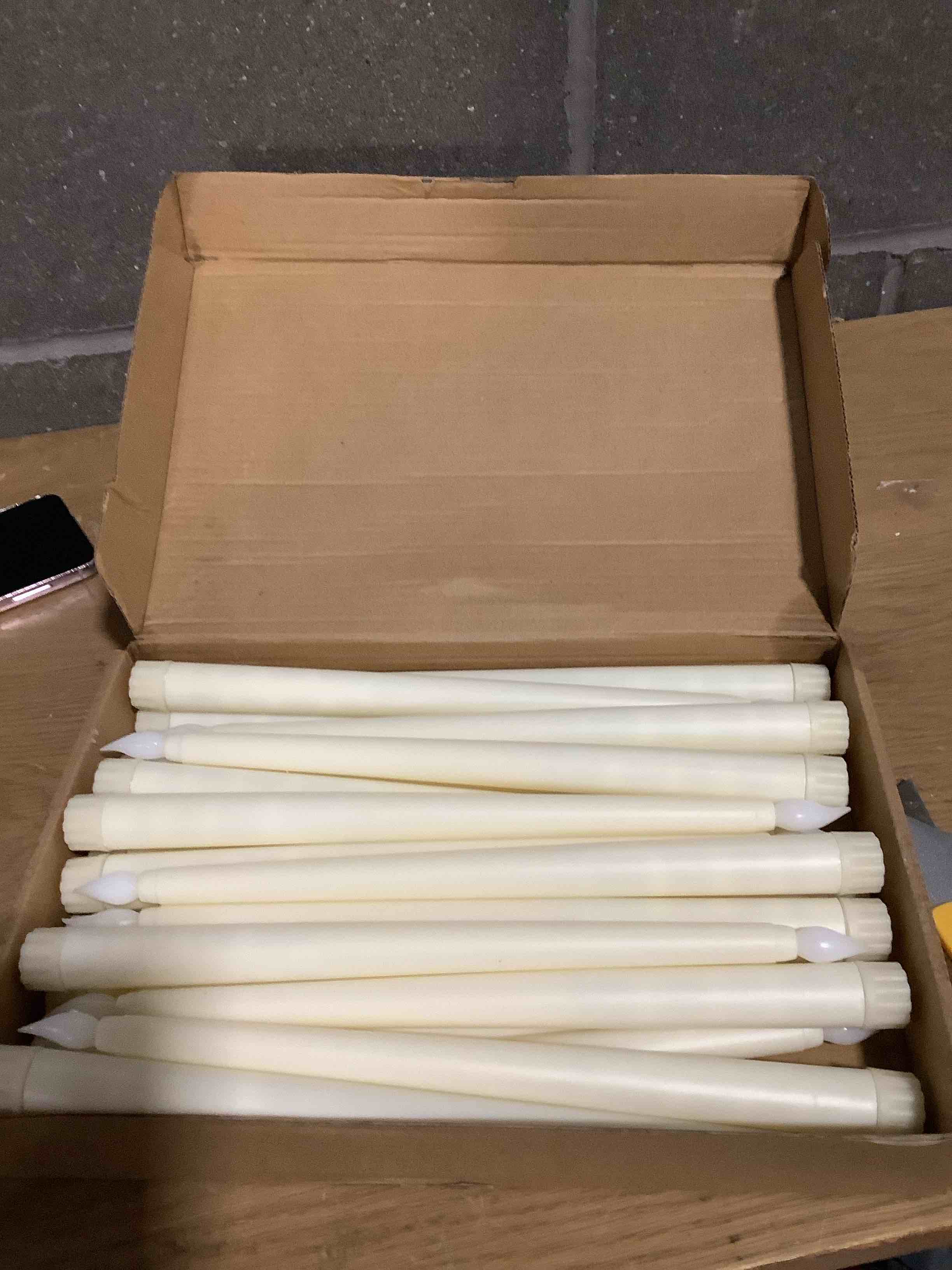 Condition photo showing Good Condition for Treela 24 Pcs Flameless Taper Candles Battery Operated Bulk Fake Candles Light LED Candle Sticks Flickering Tapered for Wedding Anniversary Decoration(Basic,11 Inch,Ivory) Basic 11 Inch Ivory