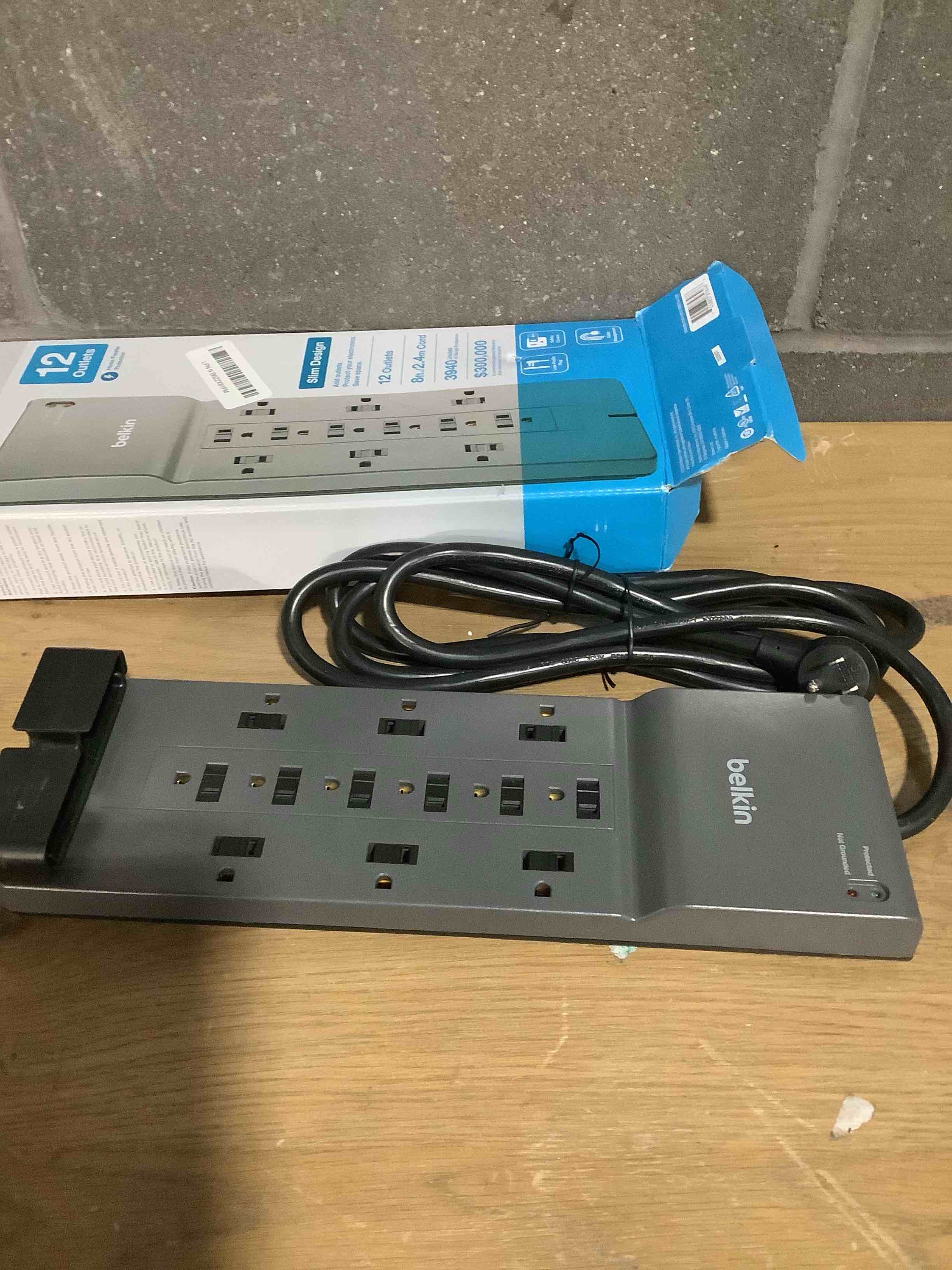 Condition photo showing Good Condition for Belkin 12-Outlet Surge Protector Power Strip w/ 12 AC Outlets & 8ft Flat Plug, UL-listed Heavy-Duty Extension Cord for Home, Office, Travel, Computer, Laptop, Charger - 3,940 Joules of Protection 1 Pack New Version