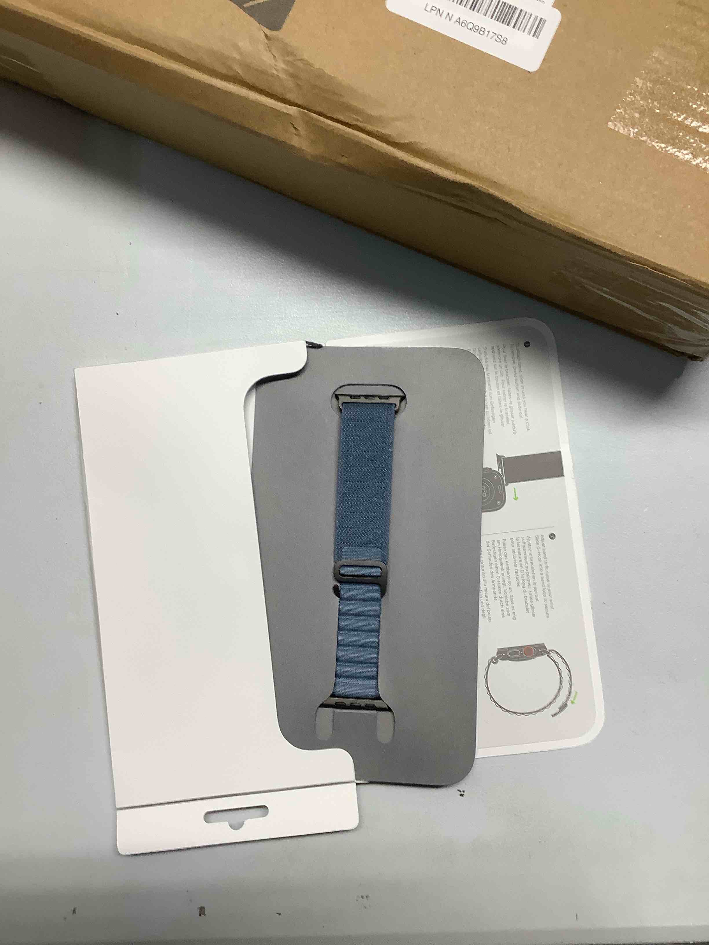 Condition photo showing Good Condition for Apple Watch Band - Alpine Loop - 49mm - Light Blue - Medium - Black Titanium Finish Light Blue Medium Black Titanium Finish