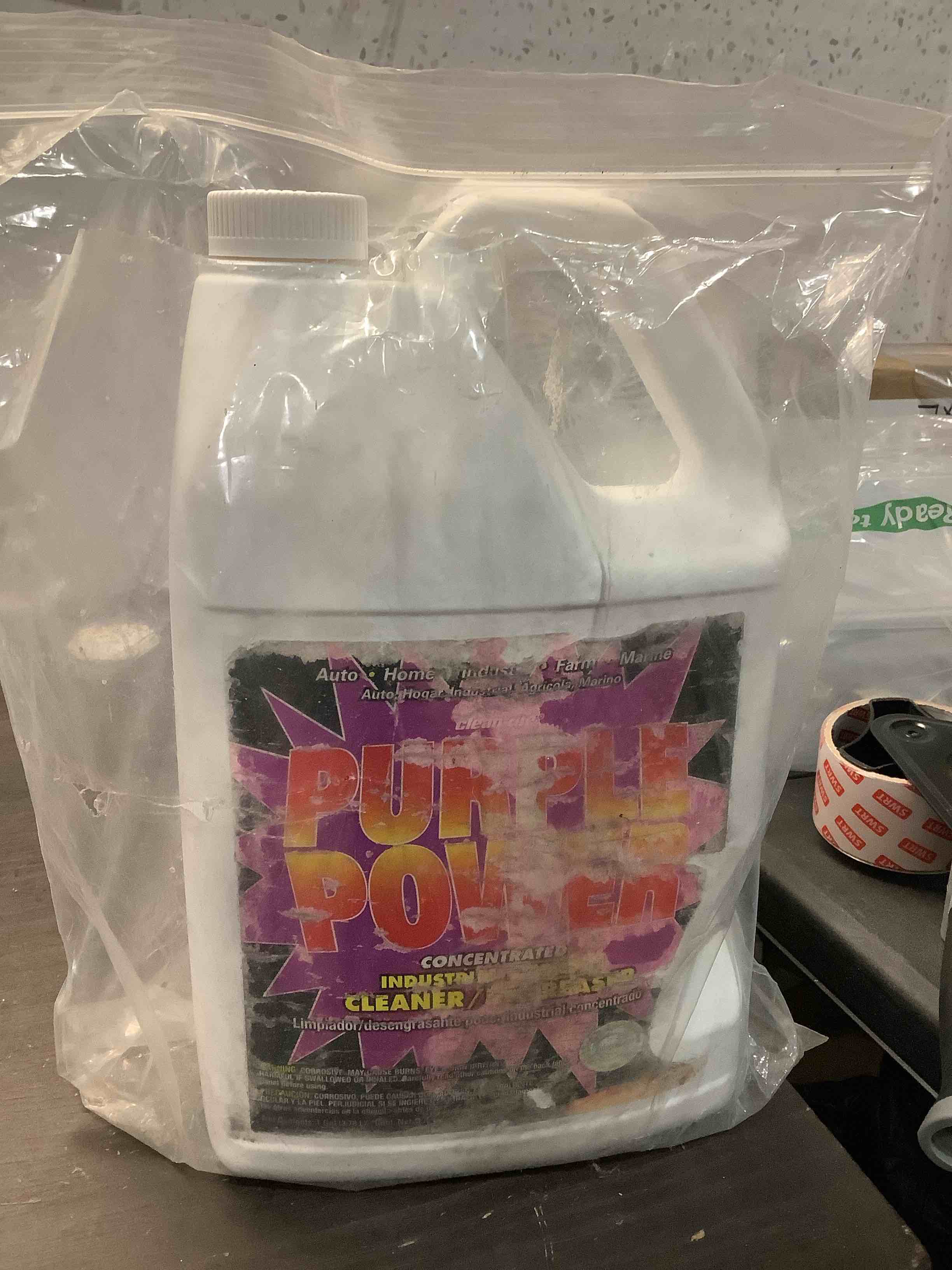 Condition photo showing As Is for purple power degreaser  1 gallon