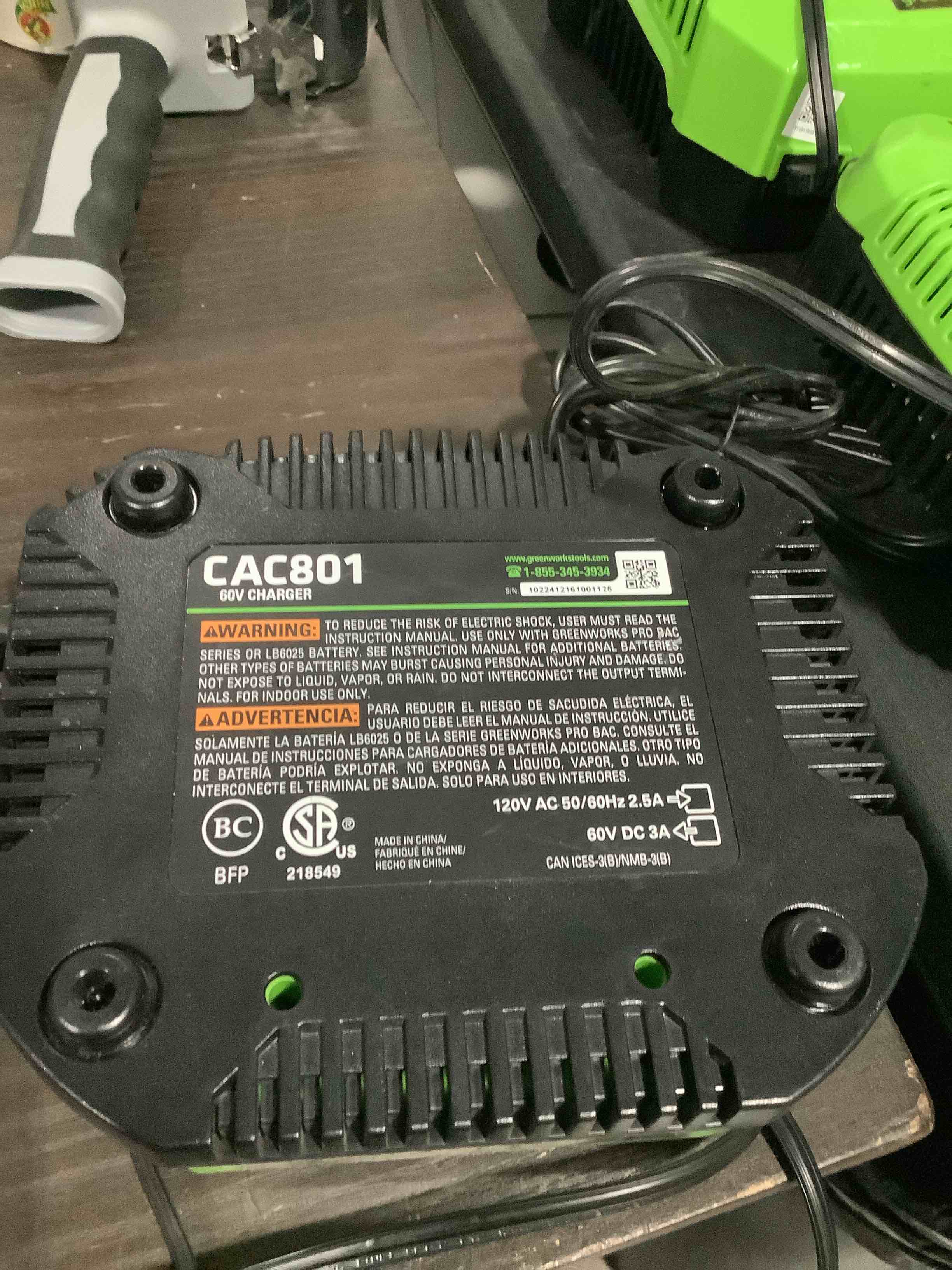 Condition photo showing As Is for greenworks pro 60v 3a standard charger 60v 3a charger