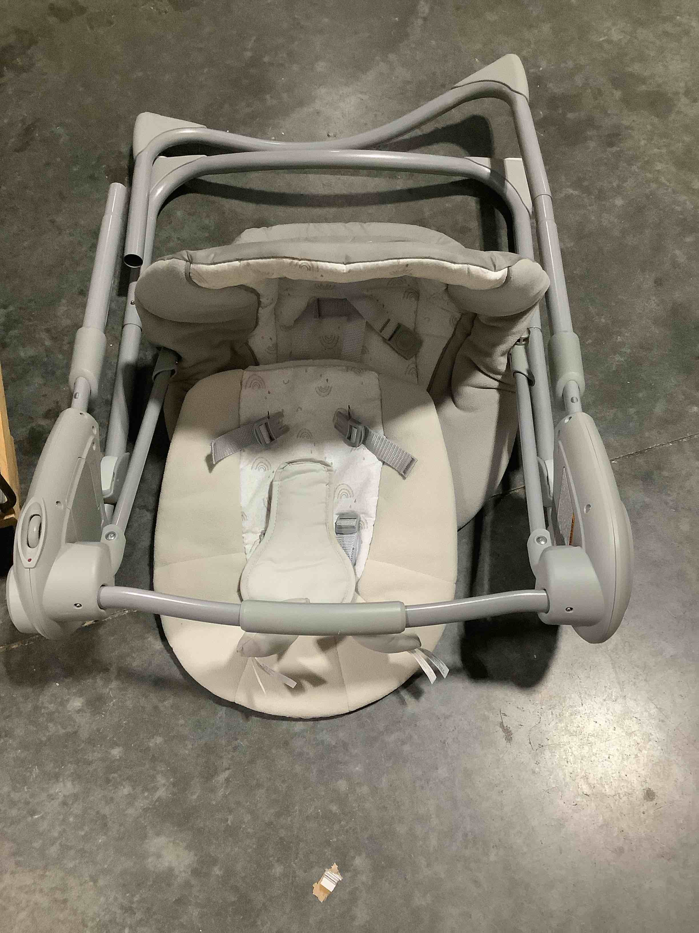 Condition photo showing As Is for graco slim spaces compact baby swing, space saving portable bay swing with height adjustable legs & soft toys, reign