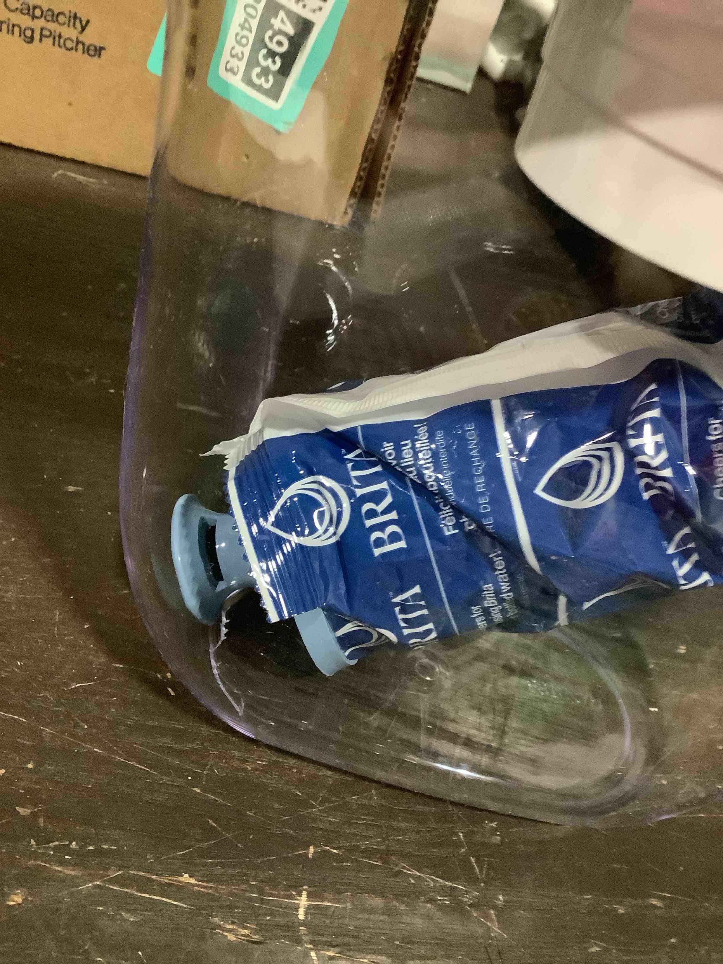 Condition photo showing As Is for brita water pitcher, metro elite filter, removes 99% of lead, includes 1 filter, 6-cup capacity, white elite filter white