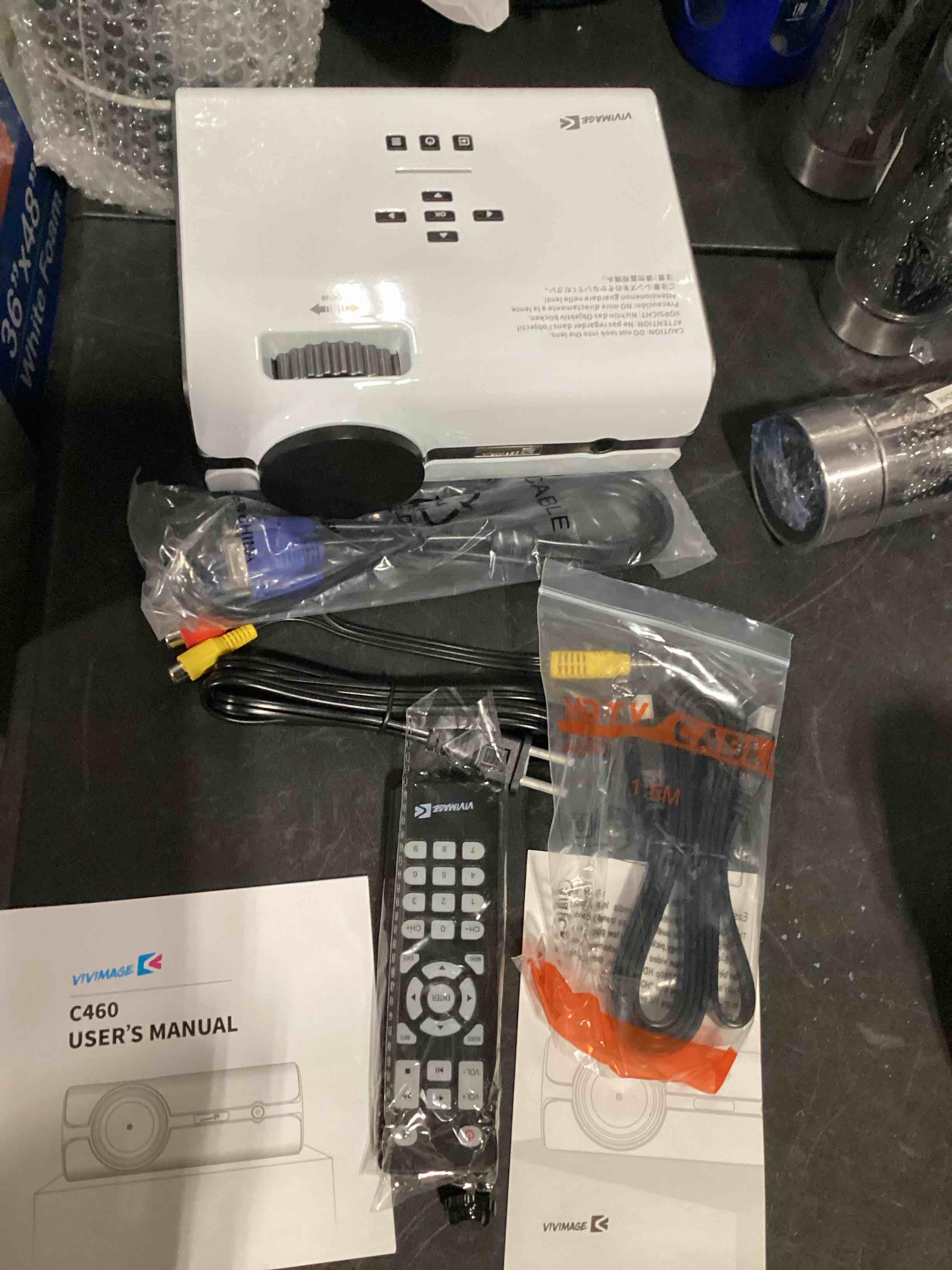 Condition photo showing New/Like New for vivimage c460 mini projector with, remote, hdmi av, cables and manual open box