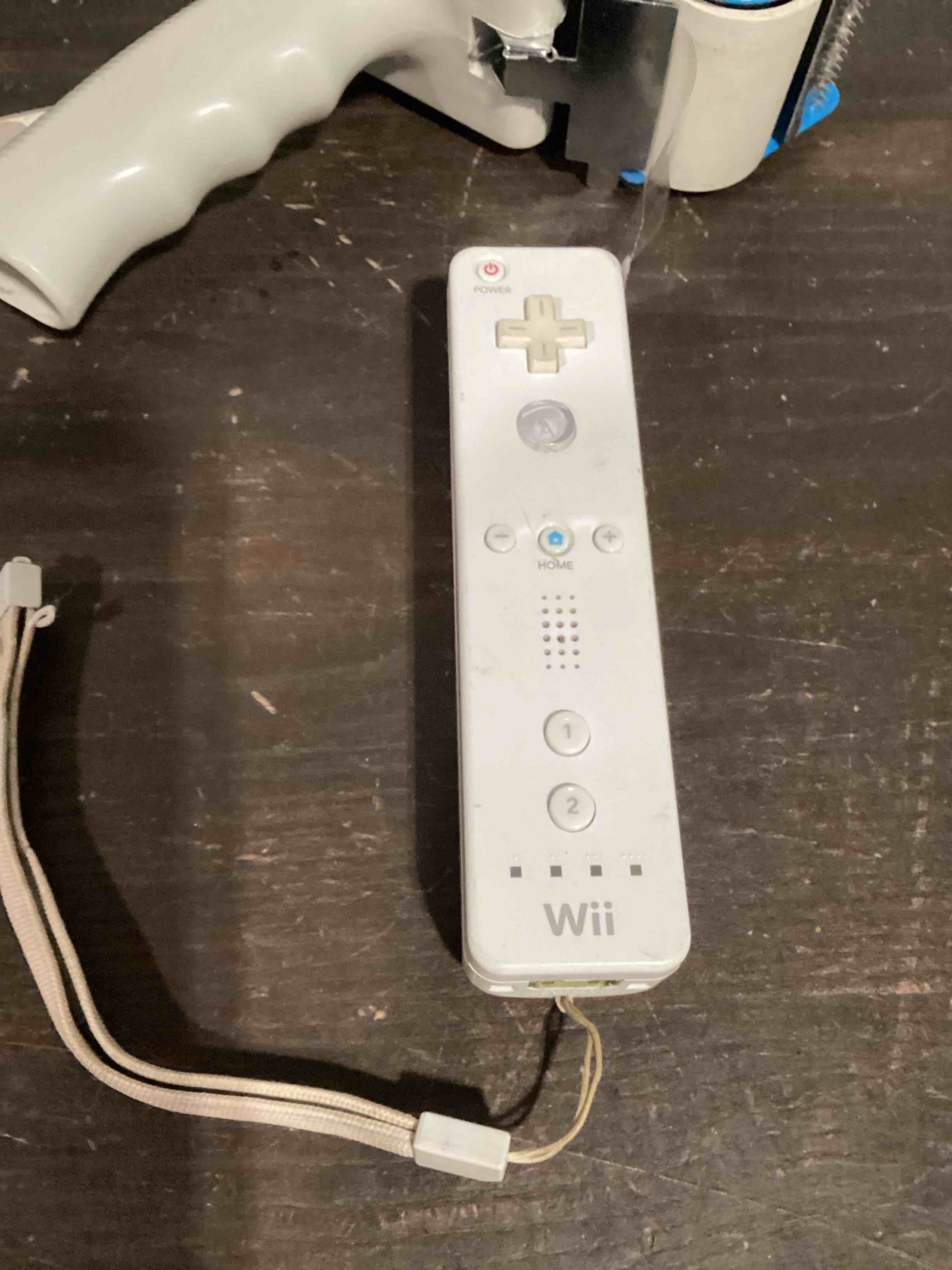 Condition photo showing As Is for wii remote controller white