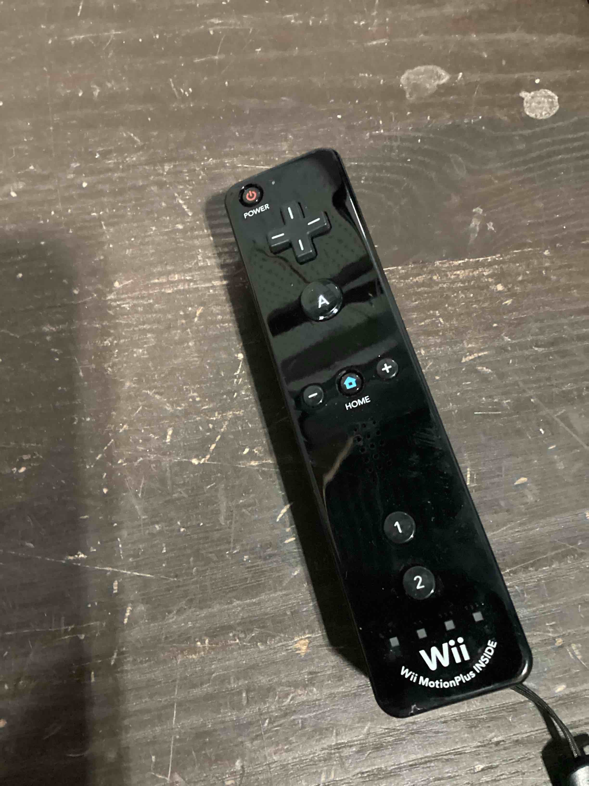 Condition photo showing As Is for wii remote controller black