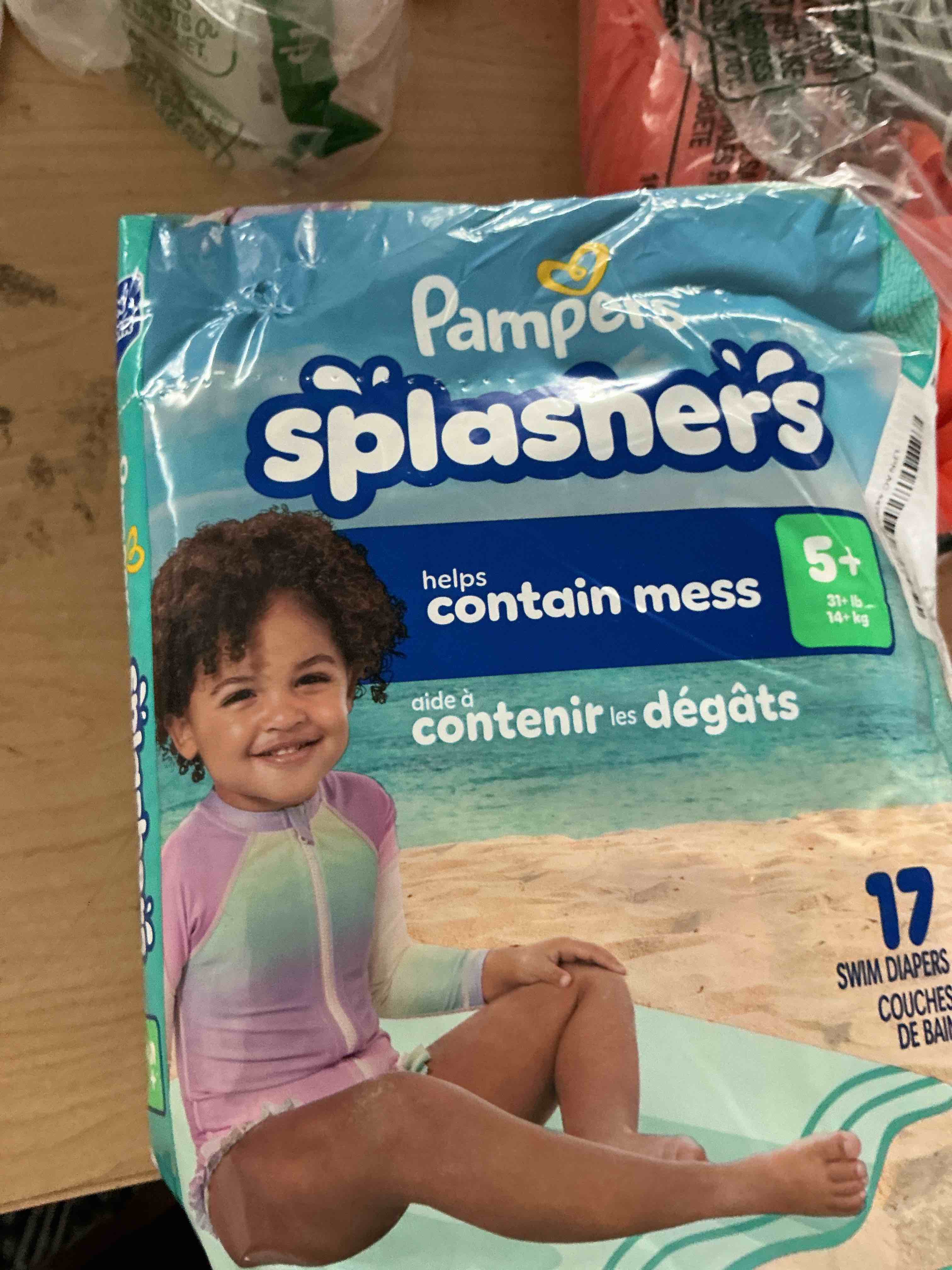 Condition photo showing New/Like New for pampers splashers swim diapers, size 5, 17 count, disposable swim diapers, contains mess, no swell