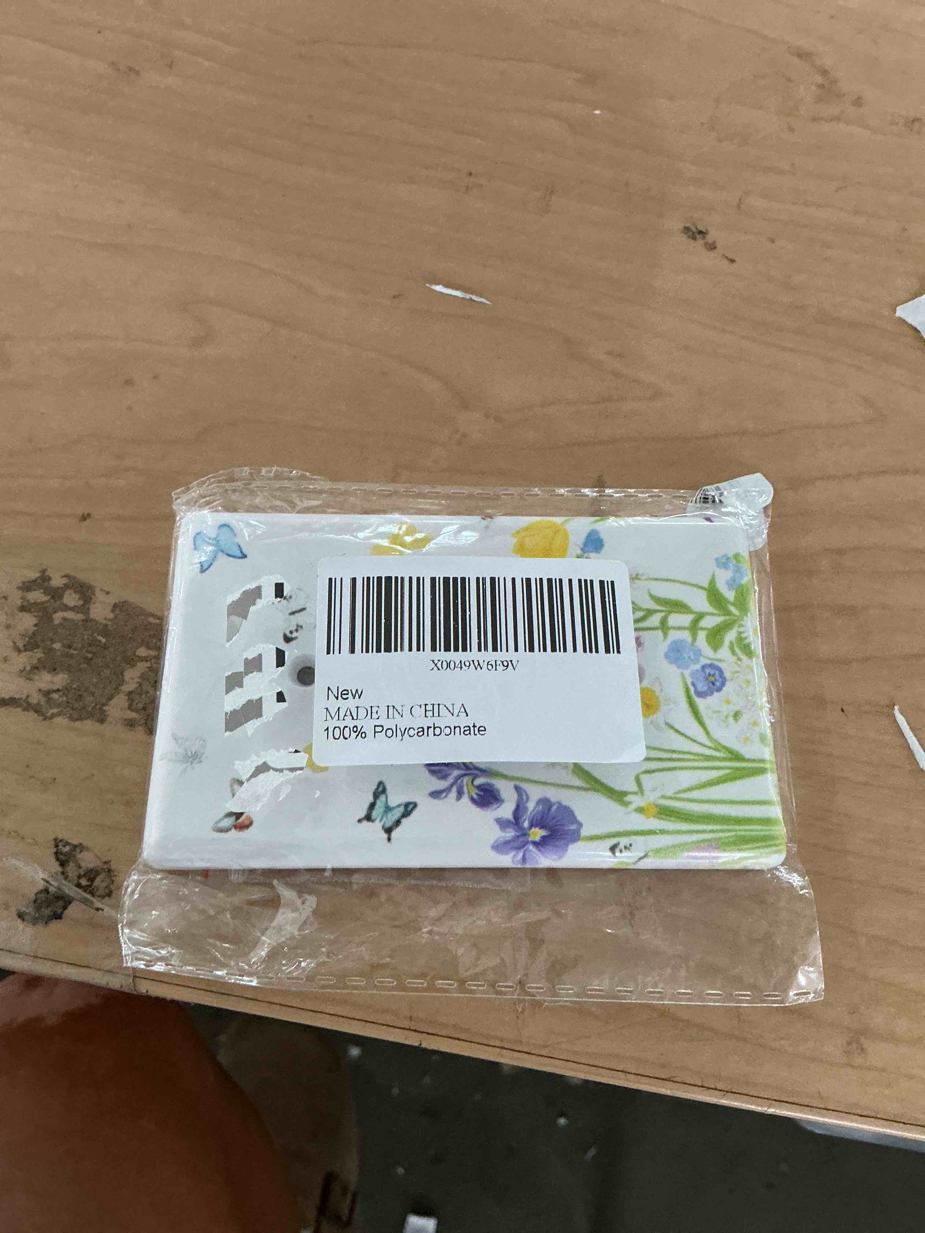 Condition photo showing New/Like New for flower butterfly single toggle light switch cover plate | fits standard 2-gang toggle and rocker switches, durable polycarbonate thermoplastic with fade-resistant printed finish