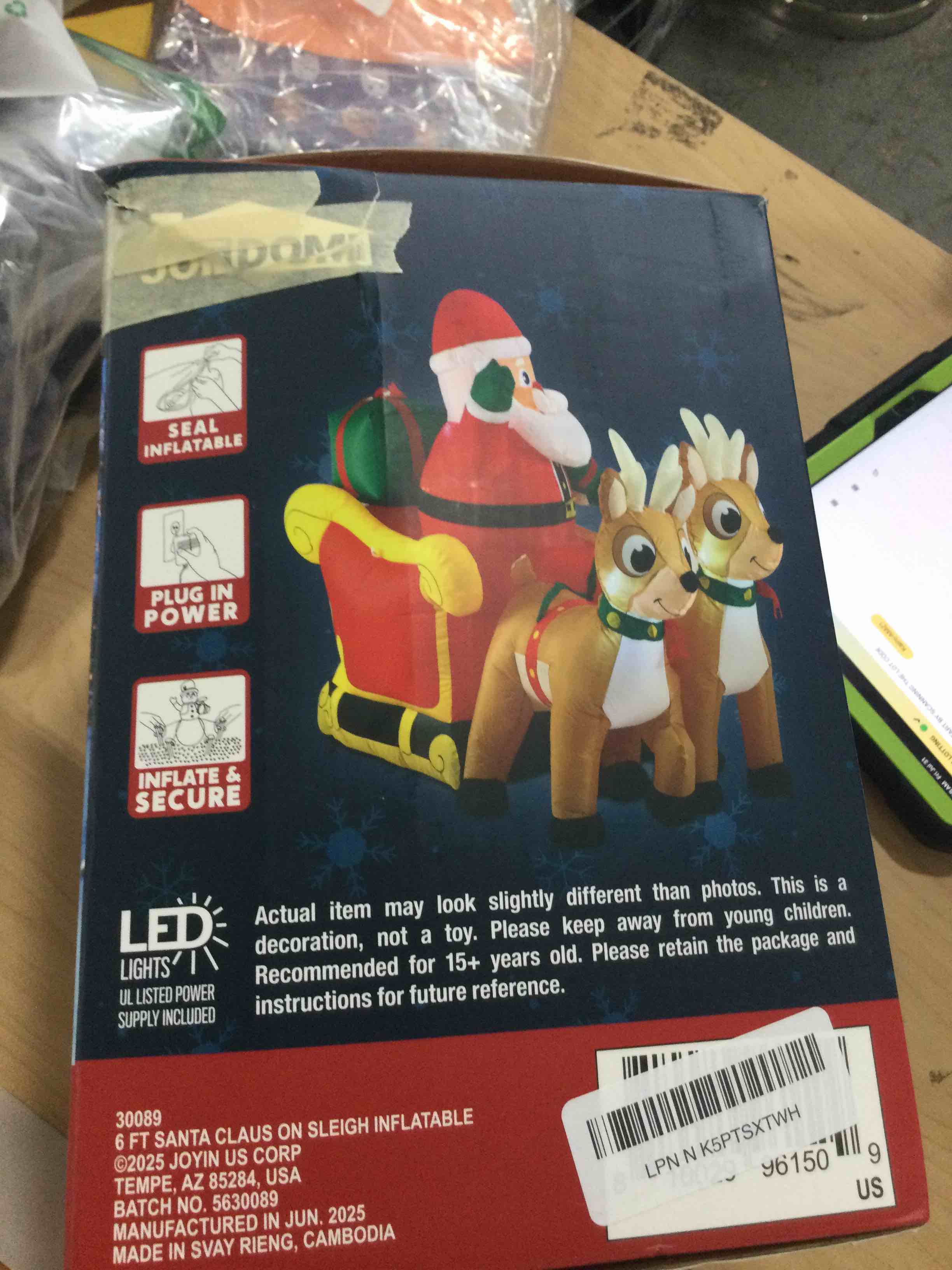 Condition photo showing New/Like New for joiedomi 6 ft long christmas inflatable santa on sleigh with 2 reindeer, inflatable christmas yard decorations with build-in led, blow up xmas decorations outdoor for party yard garden lawn décor