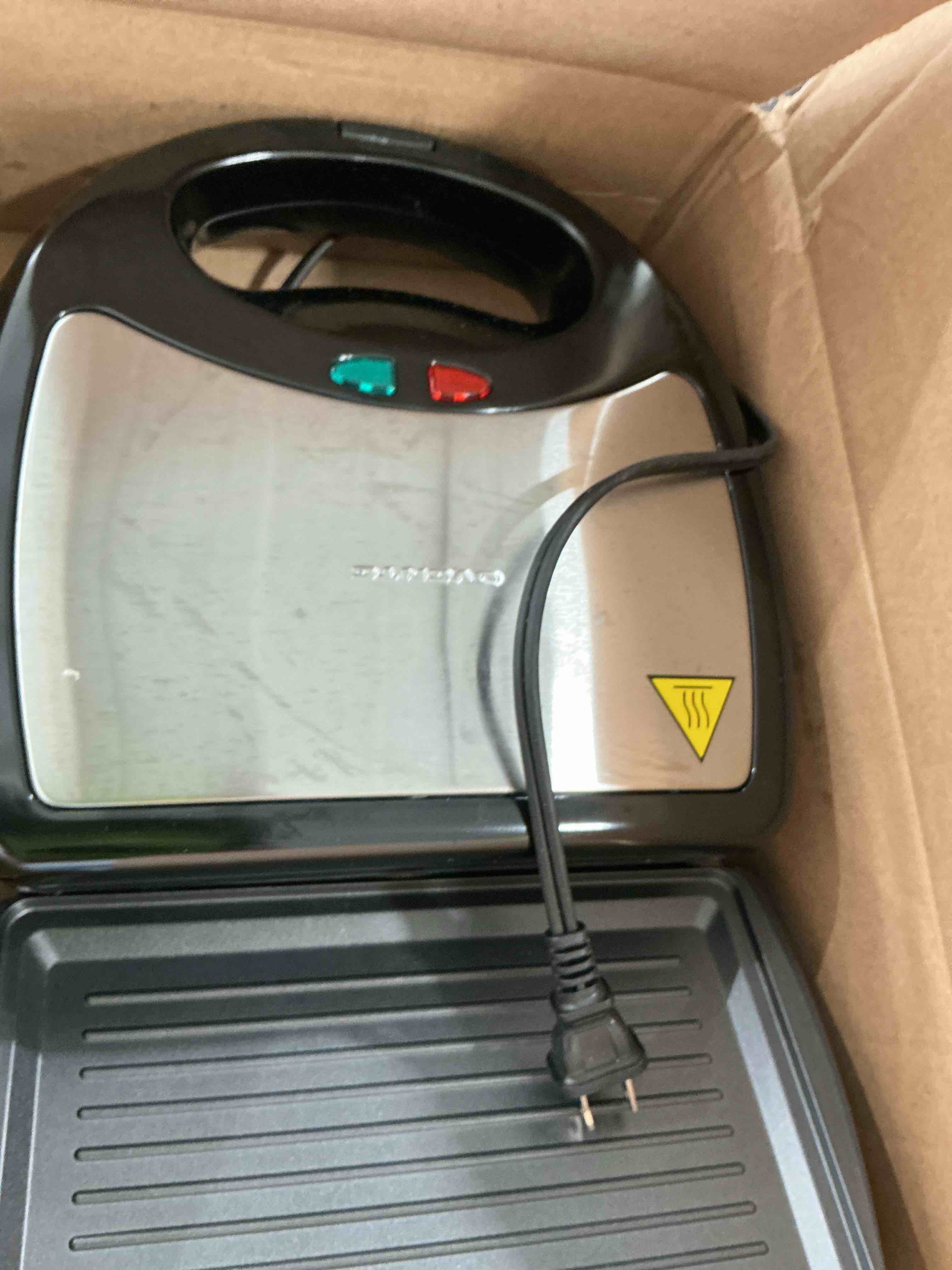 Condition photo showing New/Like New for ovente 3 in 1 electric sandwich maker, panini press grill and waffle iron set with removable non-stick plates, perfect for cooking grilled cheese, tuna melts, burgers, steaks and snacks, black gpi302b