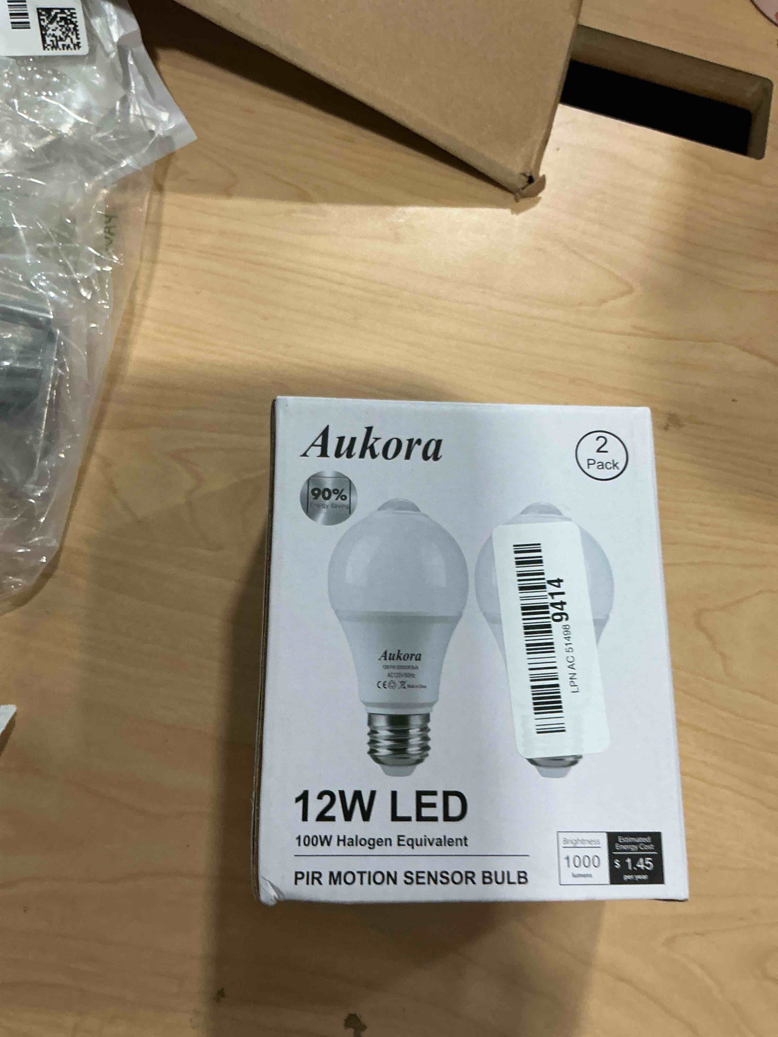 Condition photo showing New/Like New for aukora motion sensor light bulbs, 12w (100-watt equivalent) e26 motion activated dusk to dawn security bulb outdoor/indoor for front door porch garage basement hallway closet(cold white 2 pack) motion sensor-cool white 2 count (pack of 1)