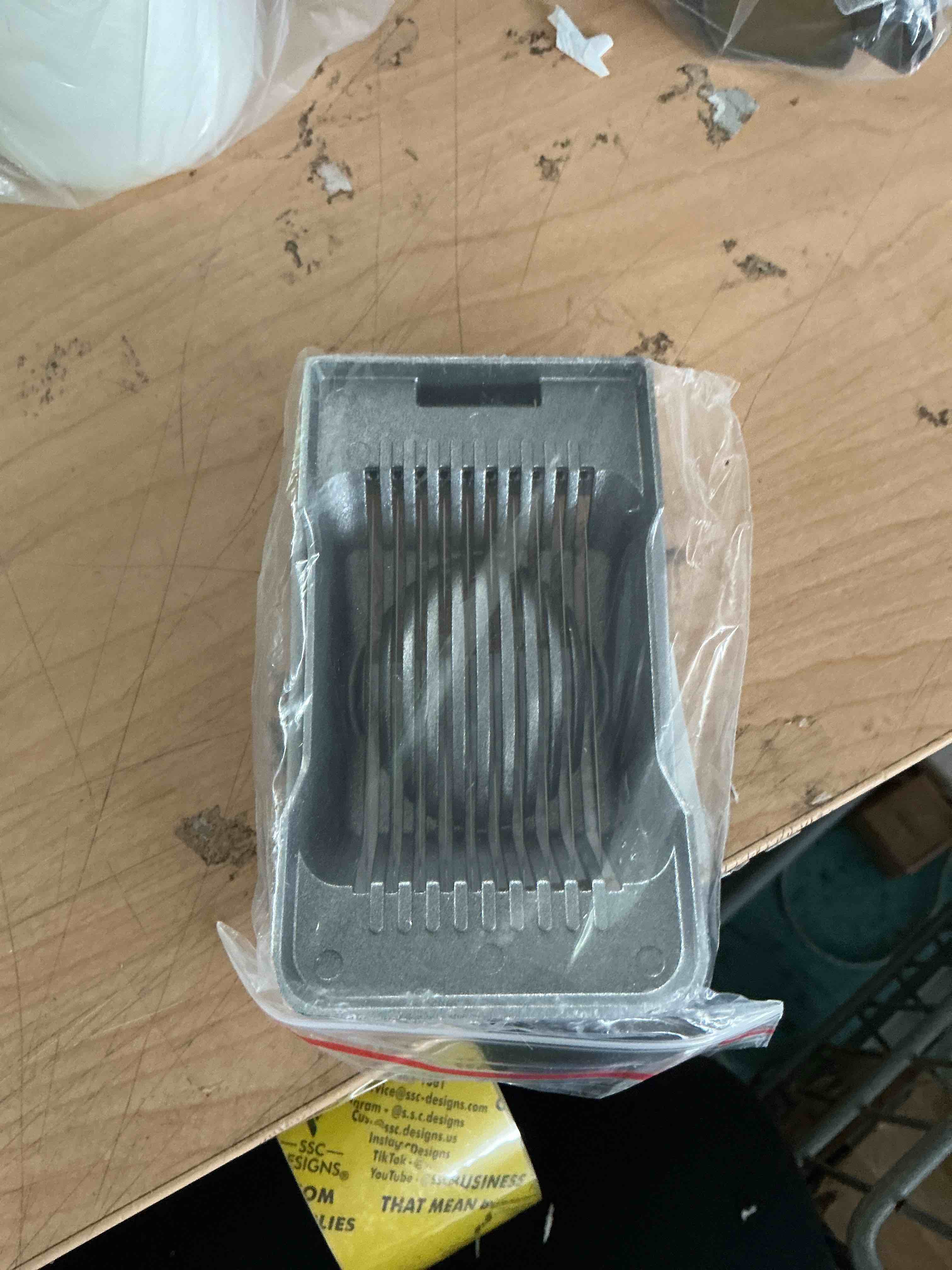 Condition photo showing New/Like New for multipurpose heavy duty aluminium egg slicer, stainless steel wire, sliver | dishwasher safe, rust resistant, egg cutter for hard boiled eggs, soft food and soft fruit, salads, butter, cheese, spam