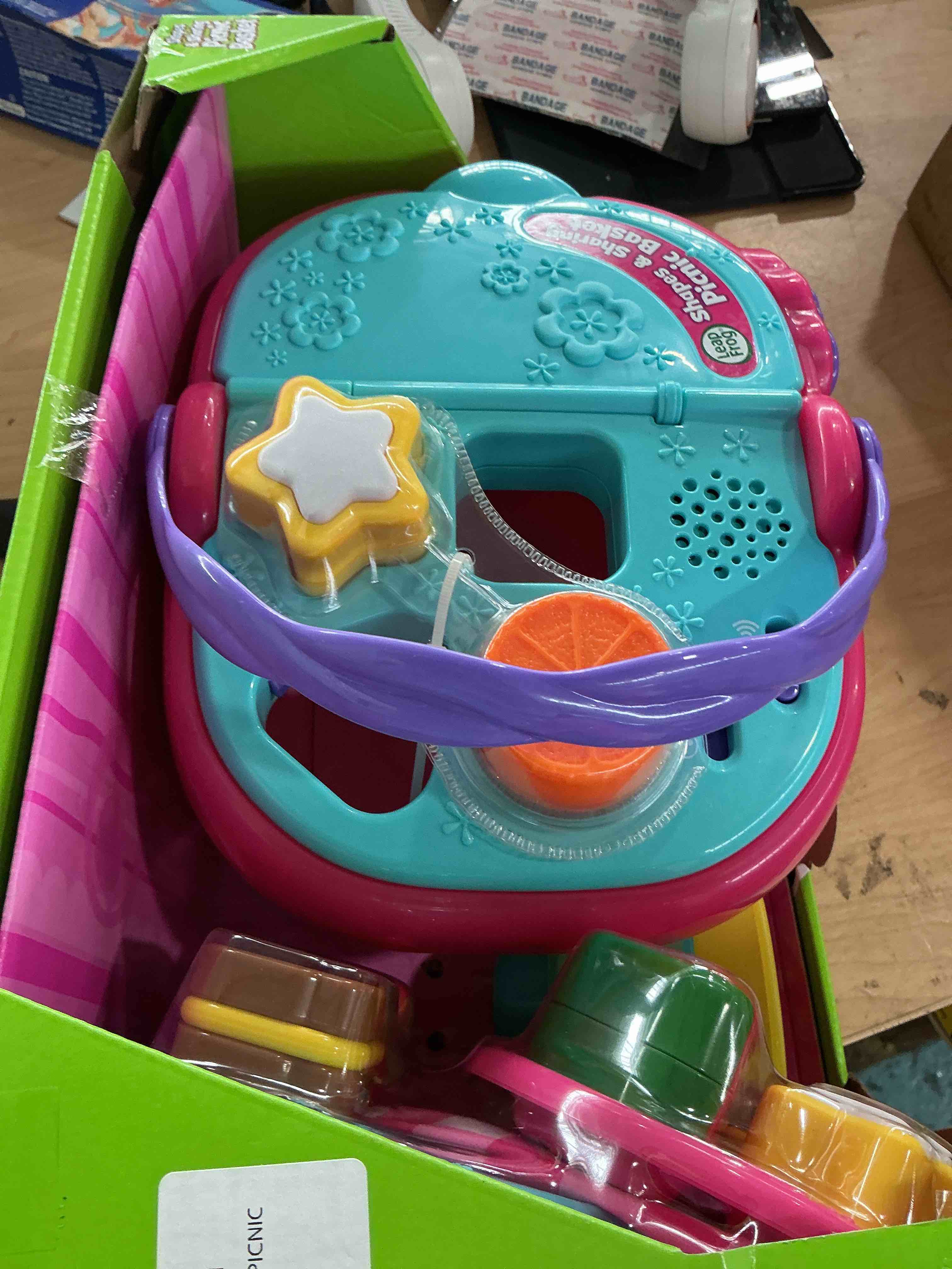 Condition photo showing New/Like New for leapfrog shapes and sharing picnic basket, pink
