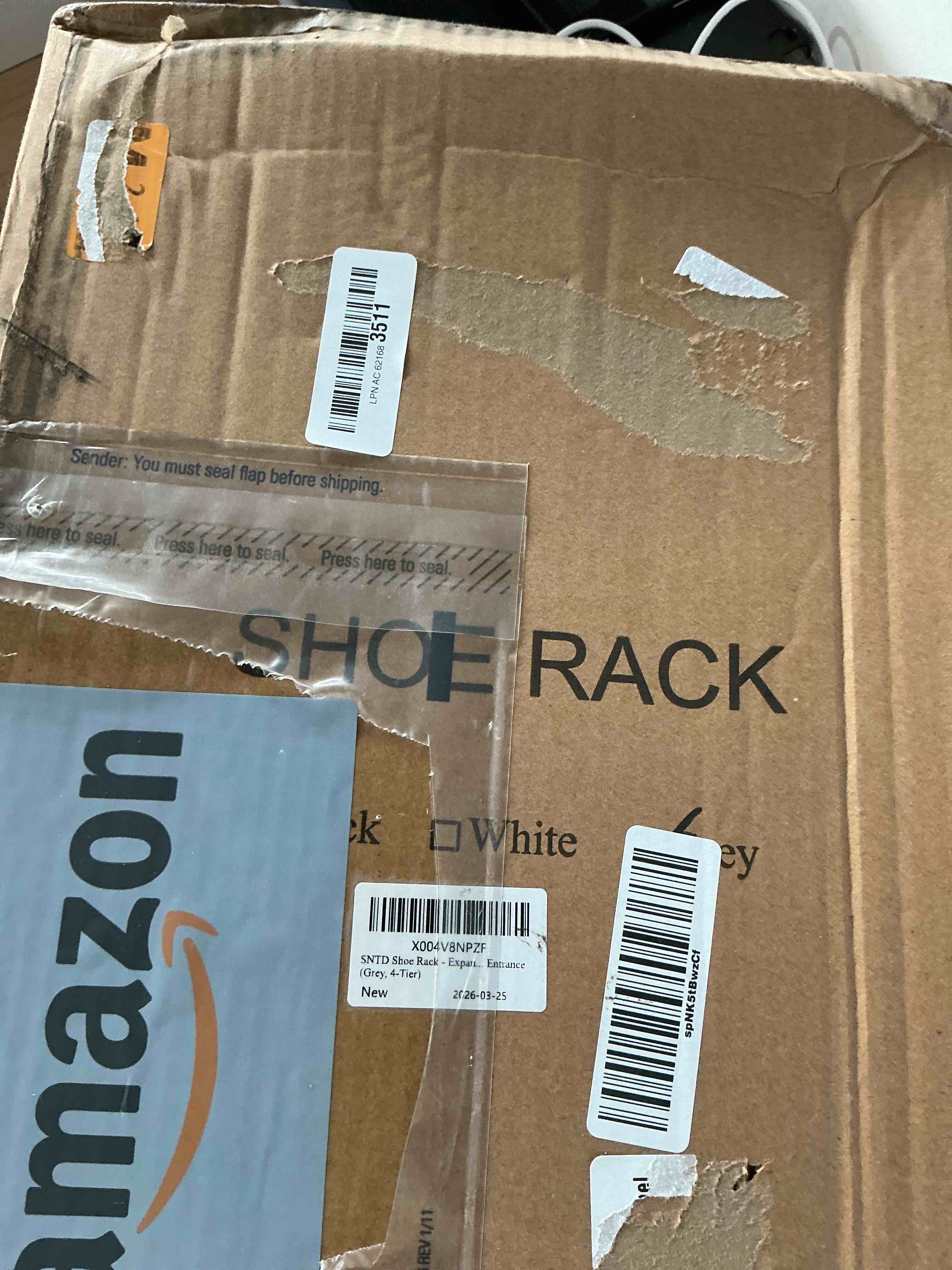 Condition photo showing New/Like New for expandable metal shoe rack for closet, entryway & garage, 4-tier, black | adjustable height for boots, stackable design, dense mesh shelves for heels, fits small spaces, apartments and rentals