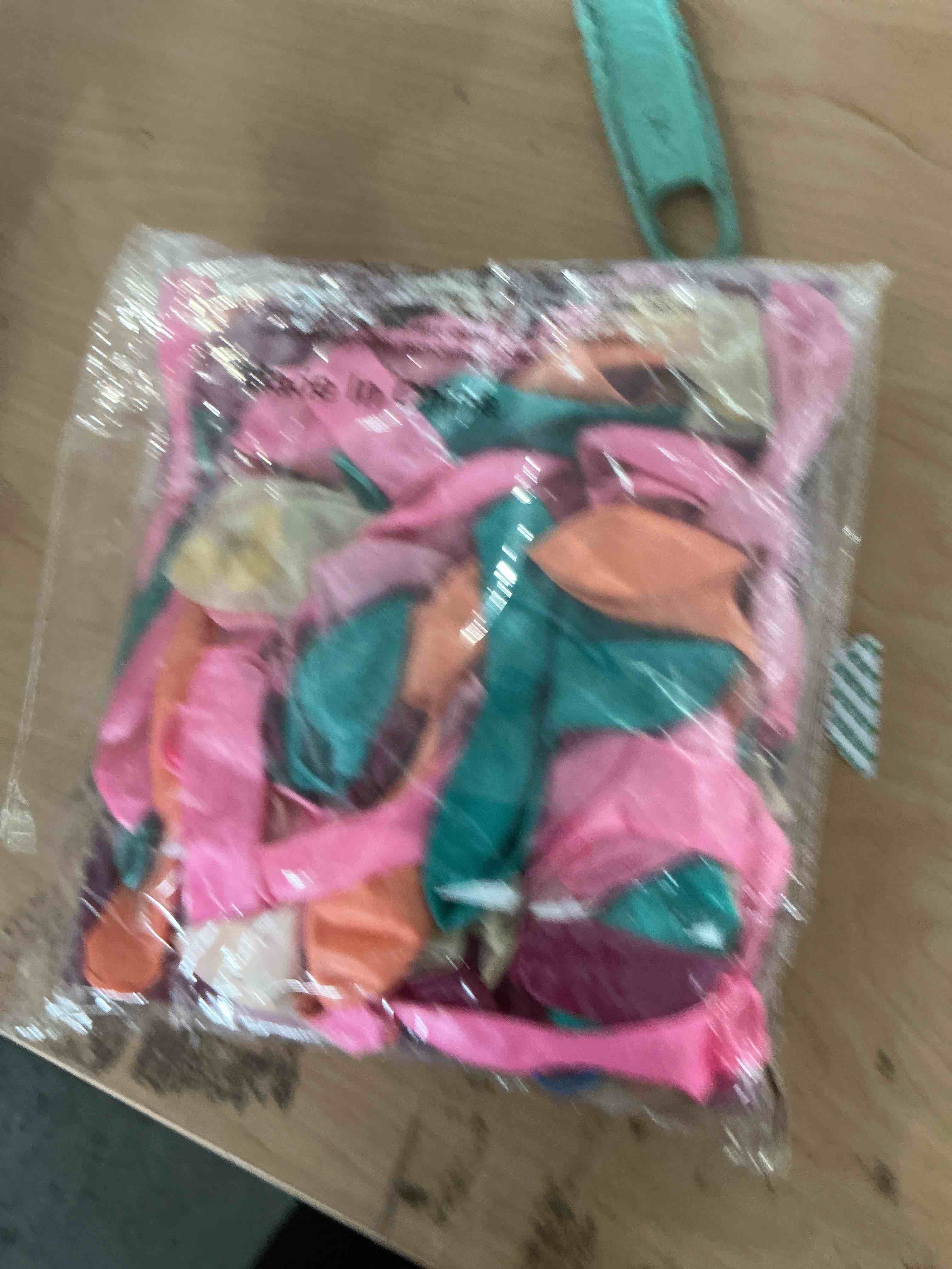Condition photo showing New/Like New for tropical balloons for hawaiian luau pool party decorations | teal, gold, orange, pink and green balloons with palm leaves, decorations for luaus, summer birthdays and hawaiian parties