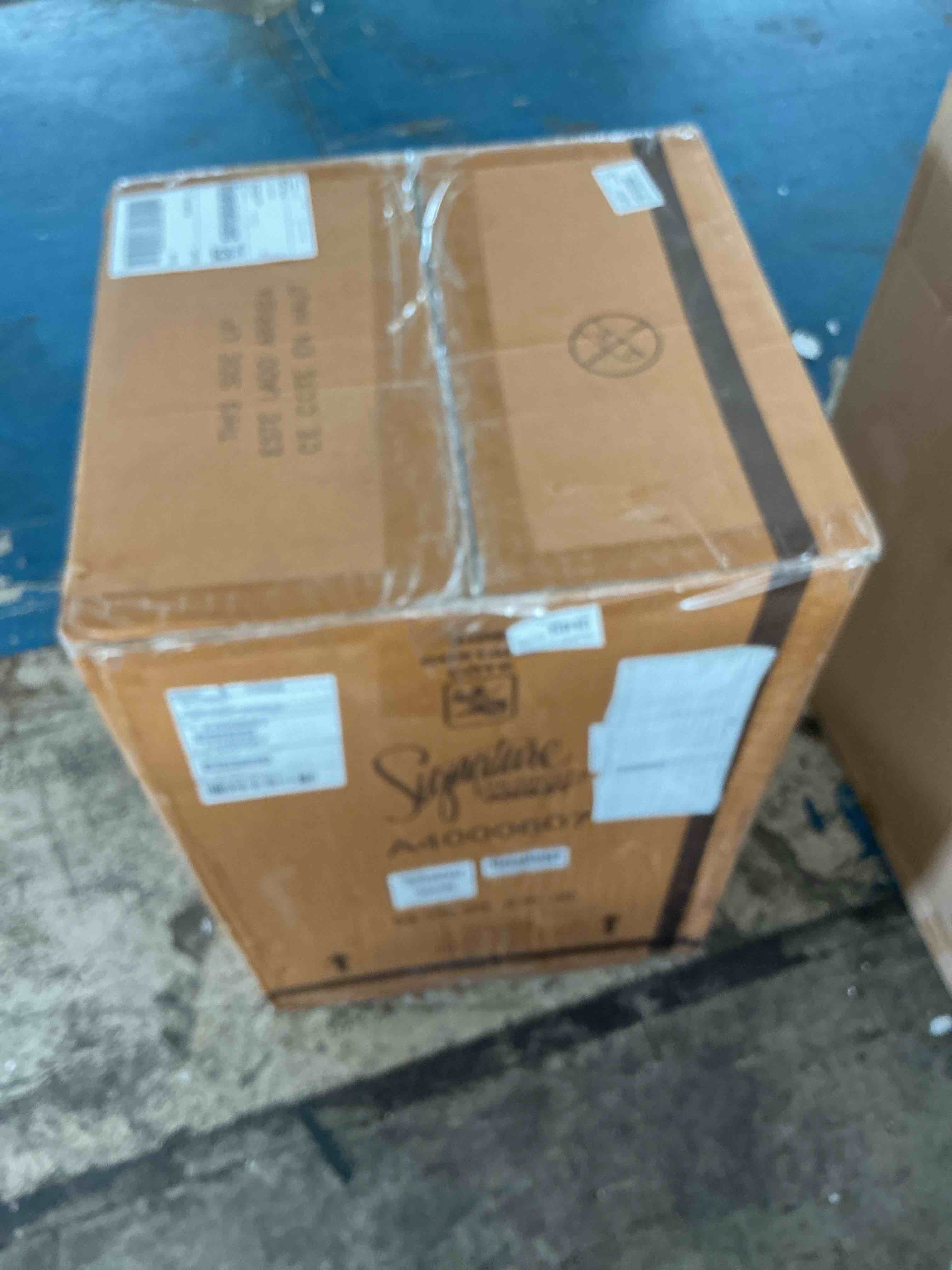 Condition photo showing New/Like New for signature design by ashley brynnleigh 15.38 in. medium brown triangle wood nesting end table (set of 2)