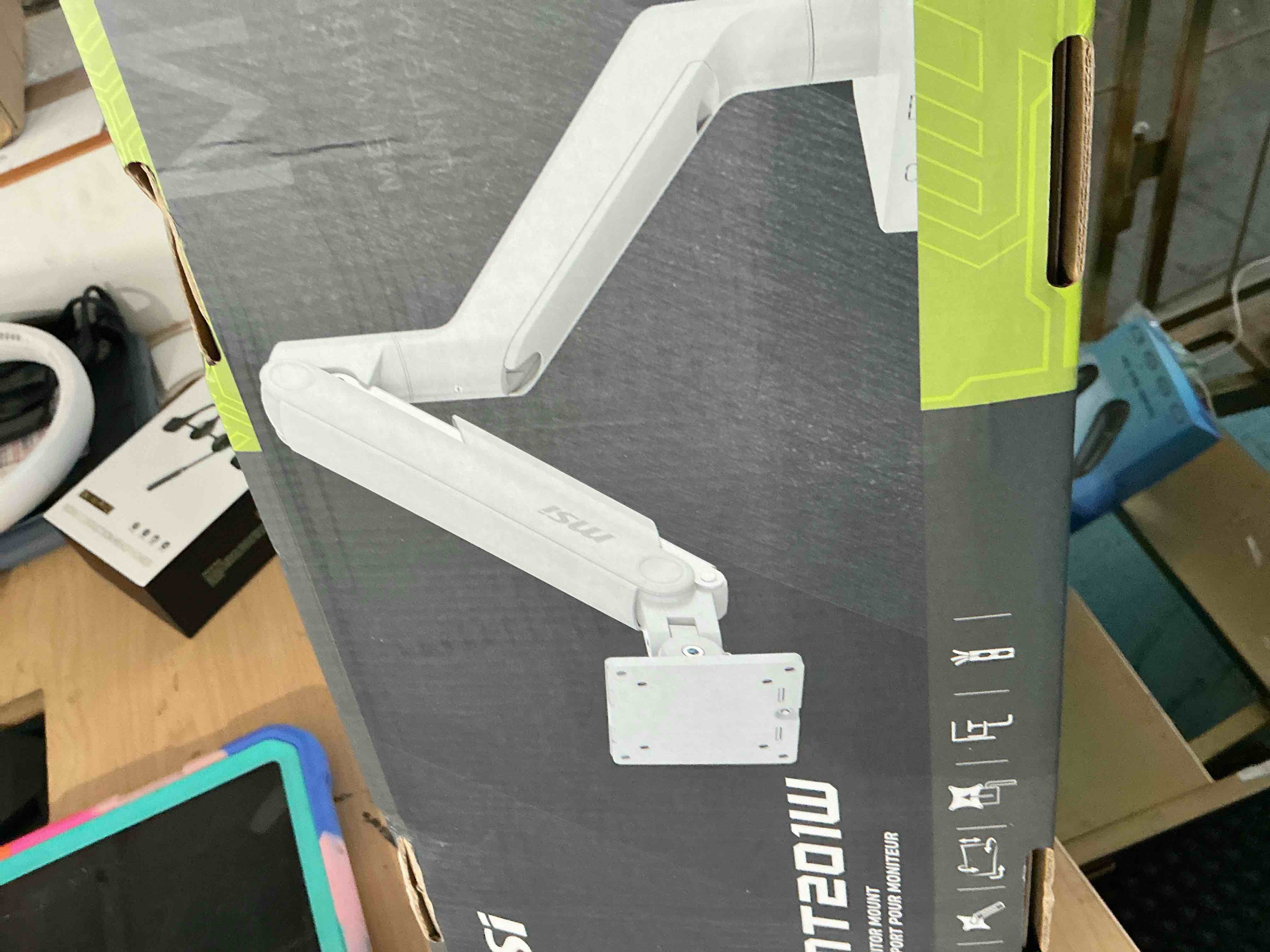 Condition photo showing New/Like New for msi mag mt201w - premium heavy duty single monitor stand arm, supports 17-49" and 44 lbs, vesa compatible, adjustable spring assisted mount, clamp & grommet, quick release plate - black