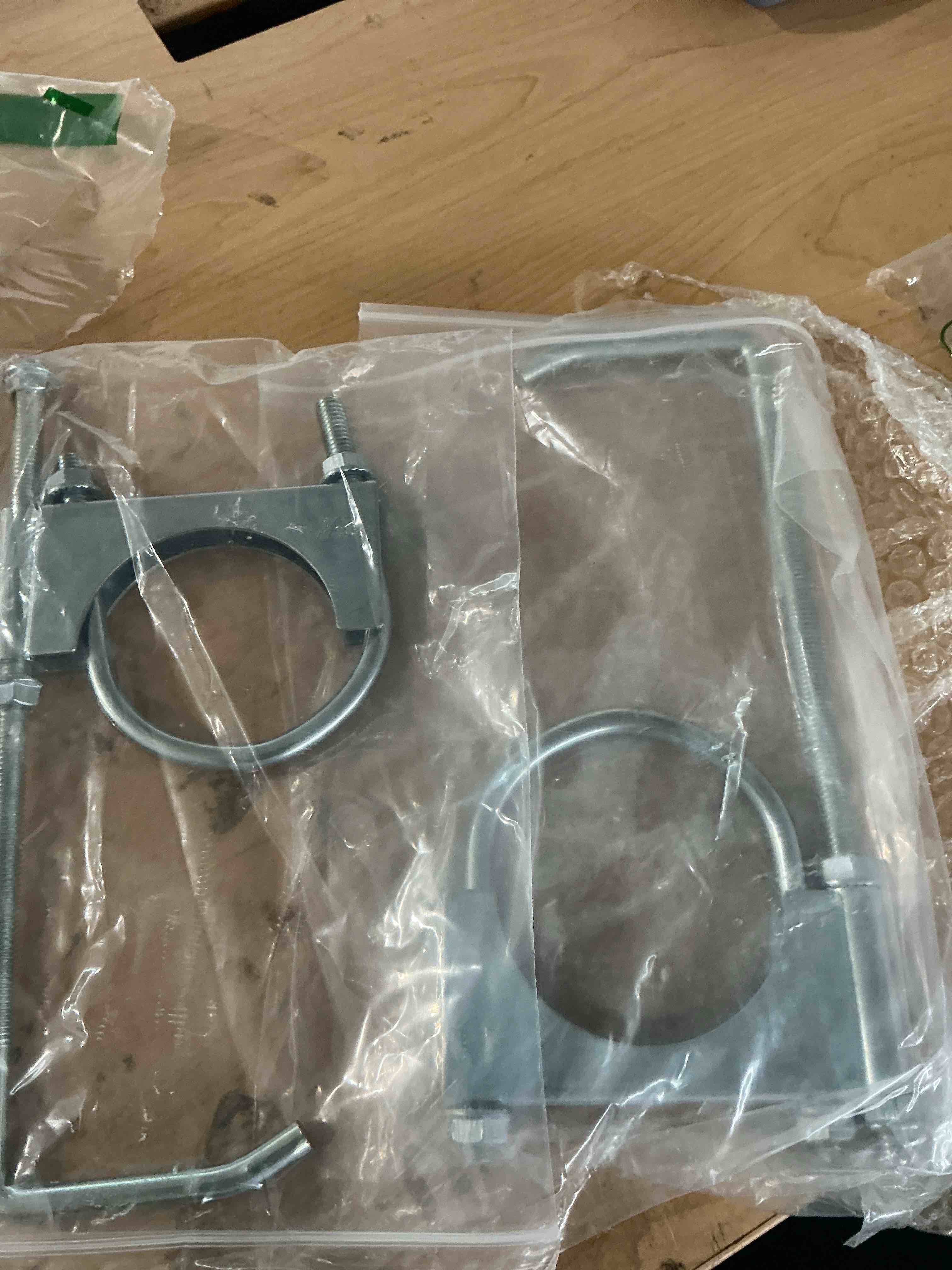 Condition photo showing New/Like New for lcgp 4" universal exhaust clamp with hanger made of heavy-duty steel clamp with rear muffler hanger exhaust pipe 2pcs