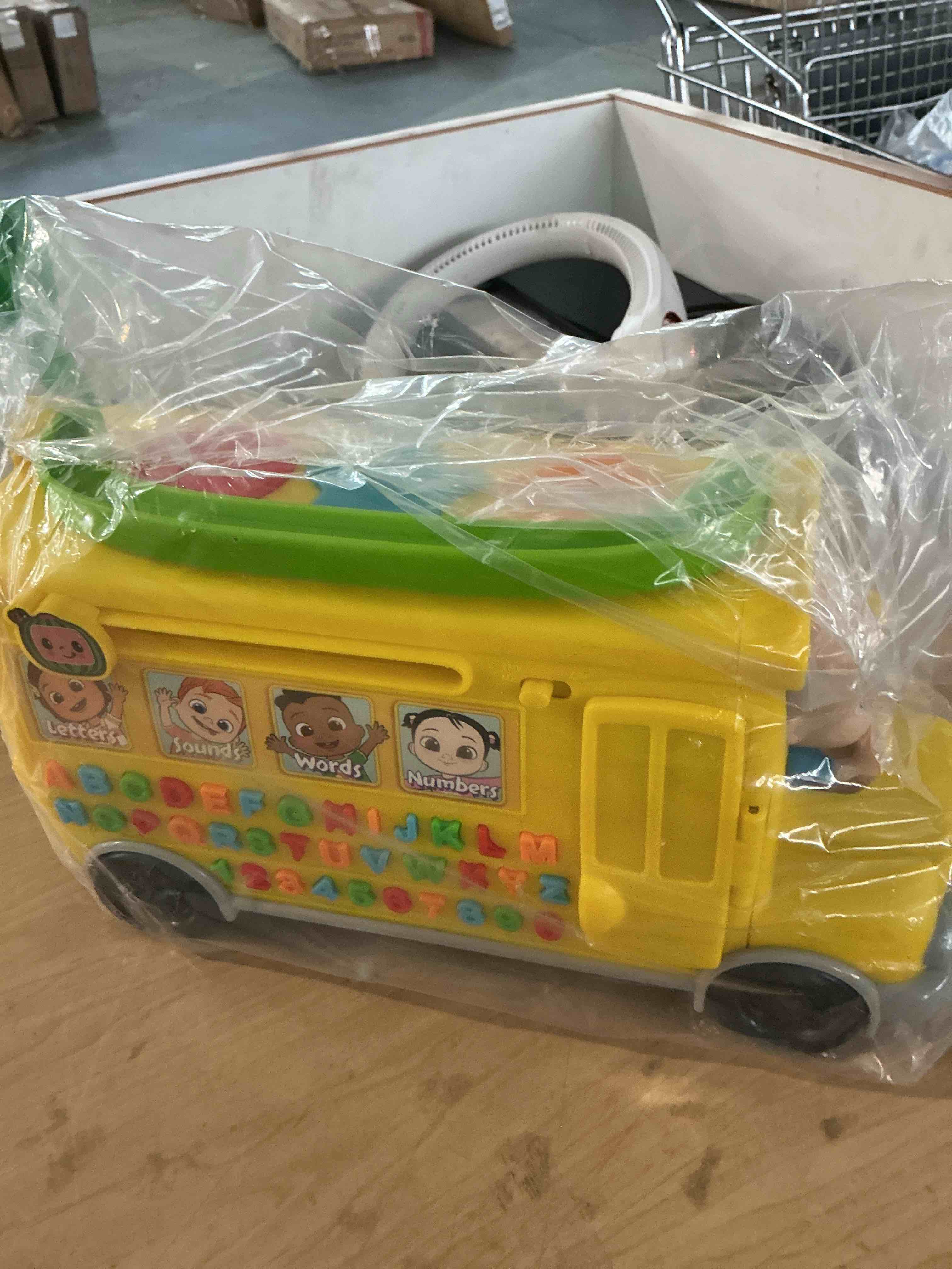 Condition photo showing New/Like New for cocomelon musical learning bus, number and letter recognition, phonetics, yellow school bus toy plays abcs and wheels on the bus, by just play