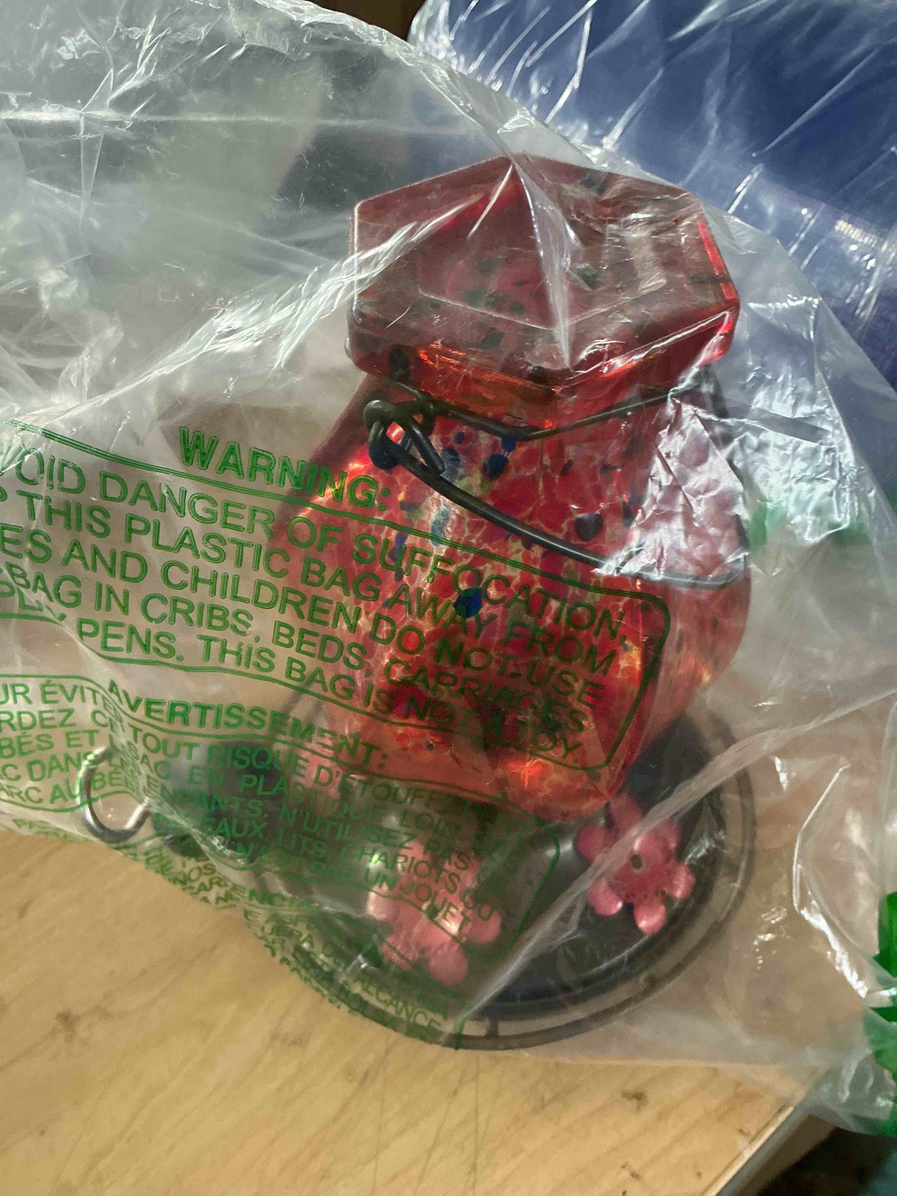 Condition photo showing New/Like New for bolite hummingbird feeders for outdoors hanging, hand blown glass, red
