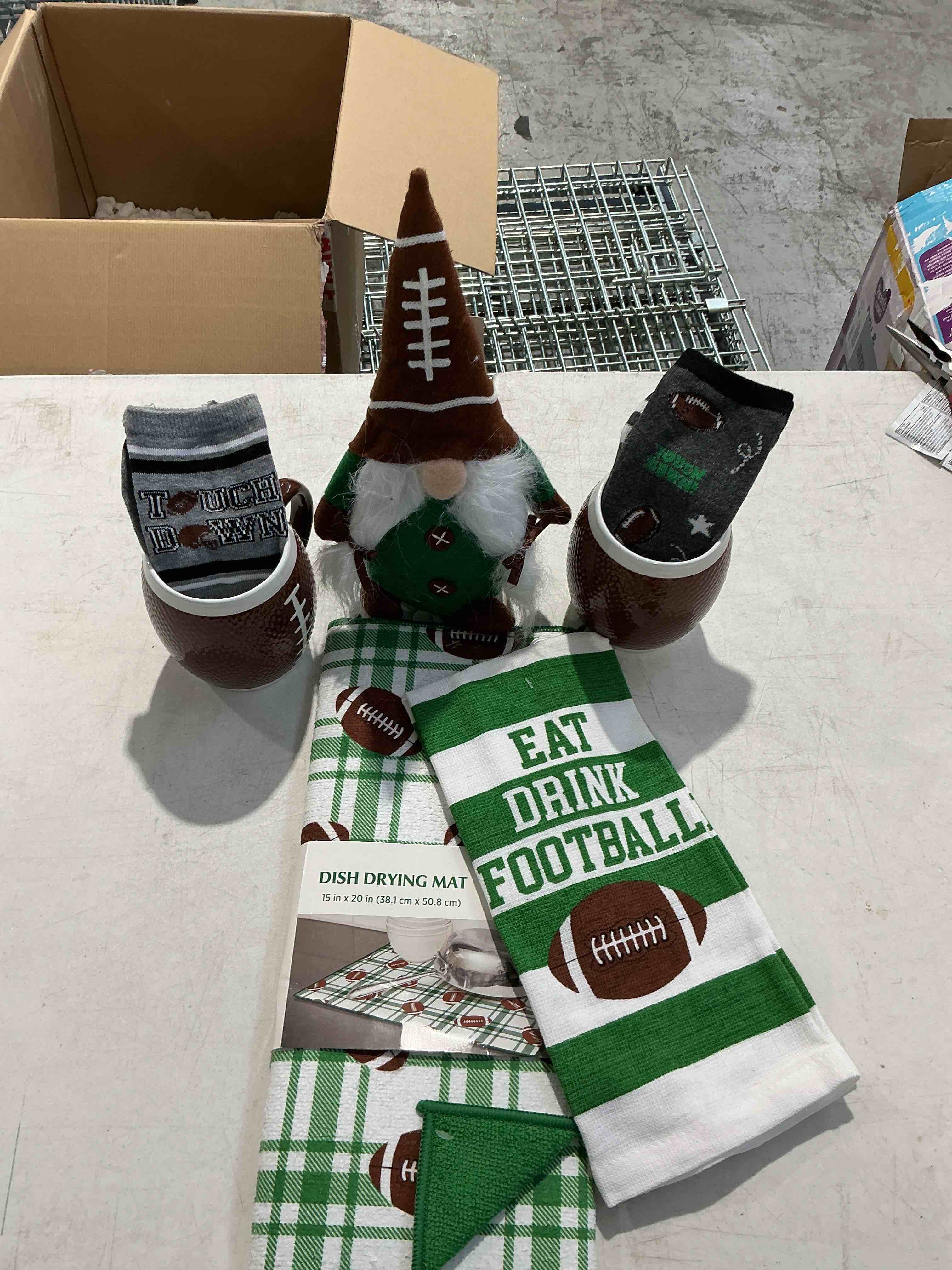 Game day, two mugs, two pairs of socks, towel, drying mat and gnome plush