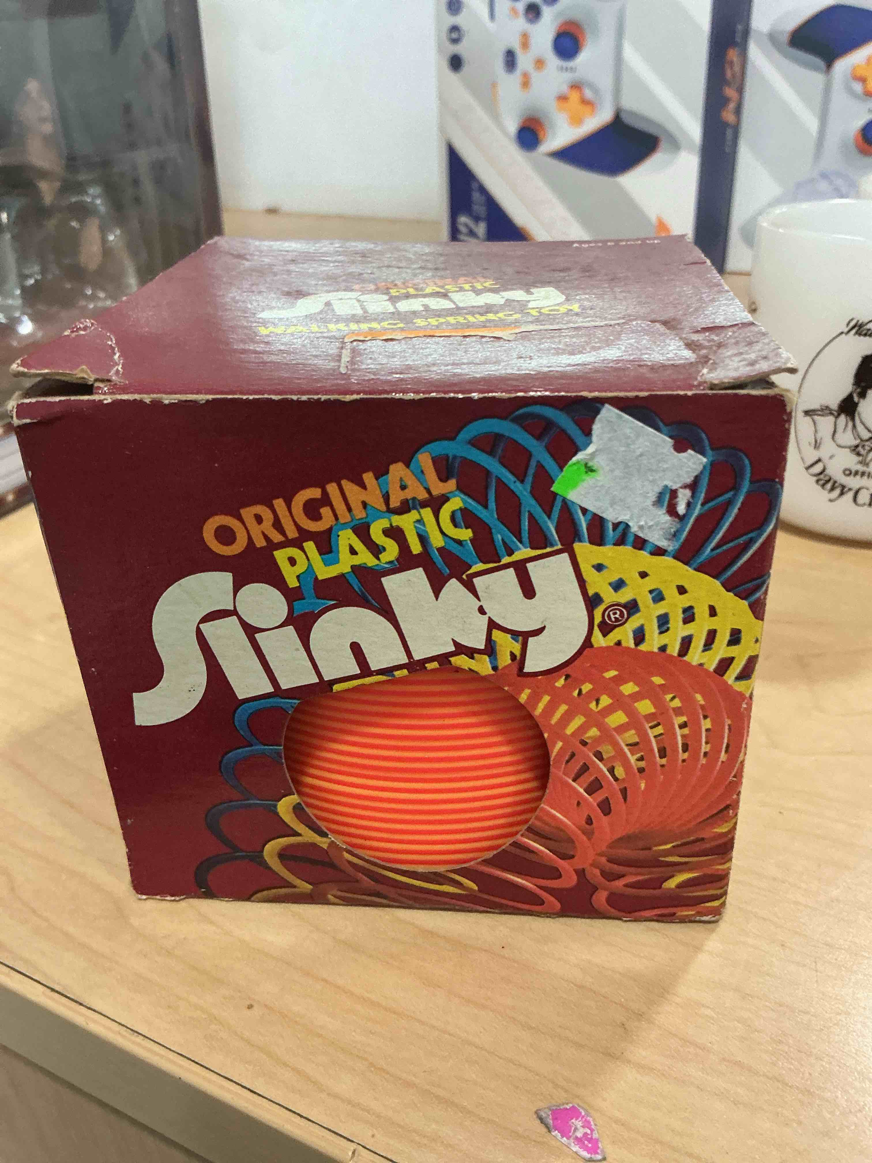Condition photo showing Good Condition for the original slinky walking spring toy, 2.75-inch diameter metal slinky, fidget toys small
