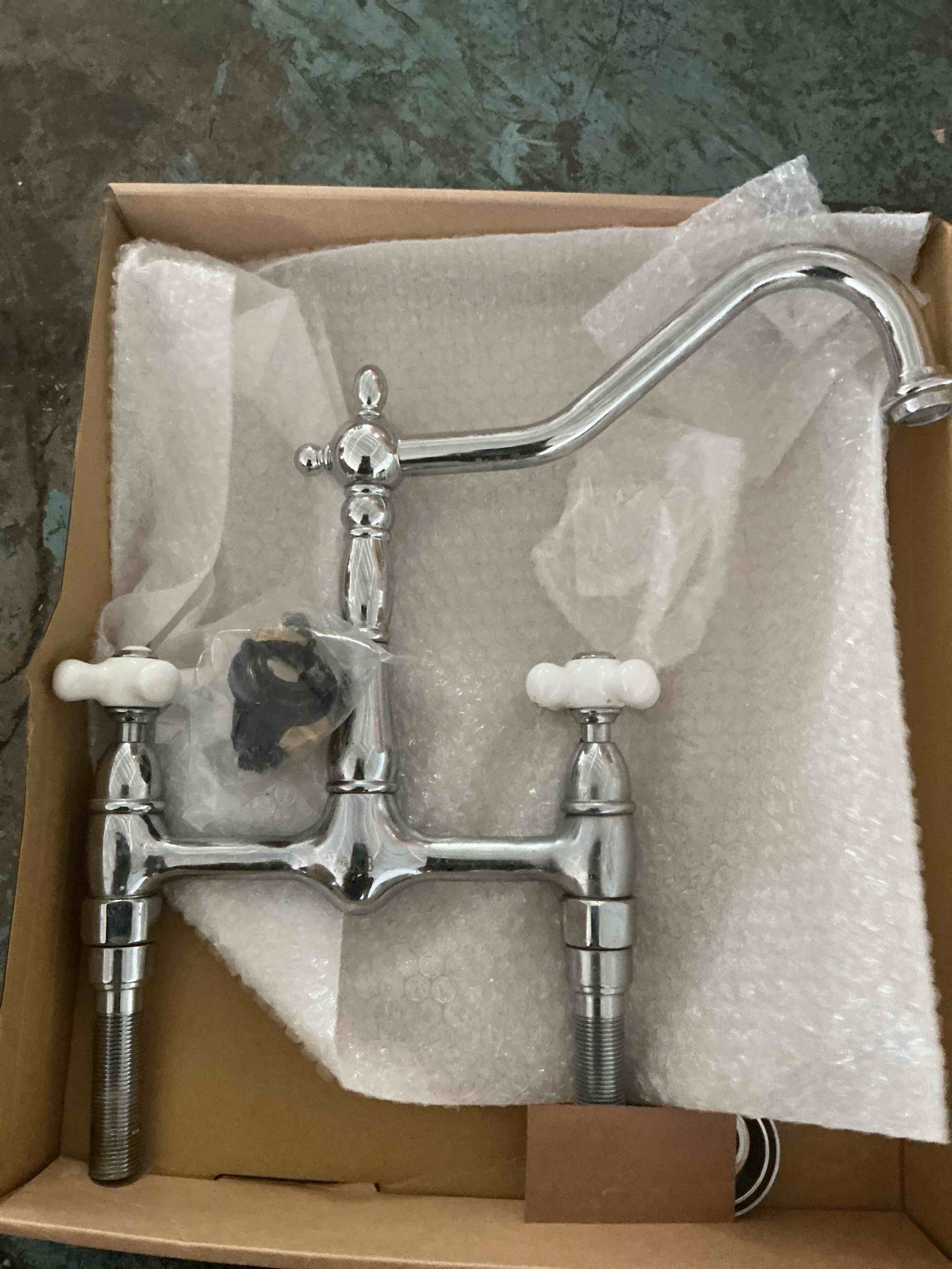 Condition photo showing New/Like New for kingston brass ks1811plbs widespread kitchen faucet, polished white handles
