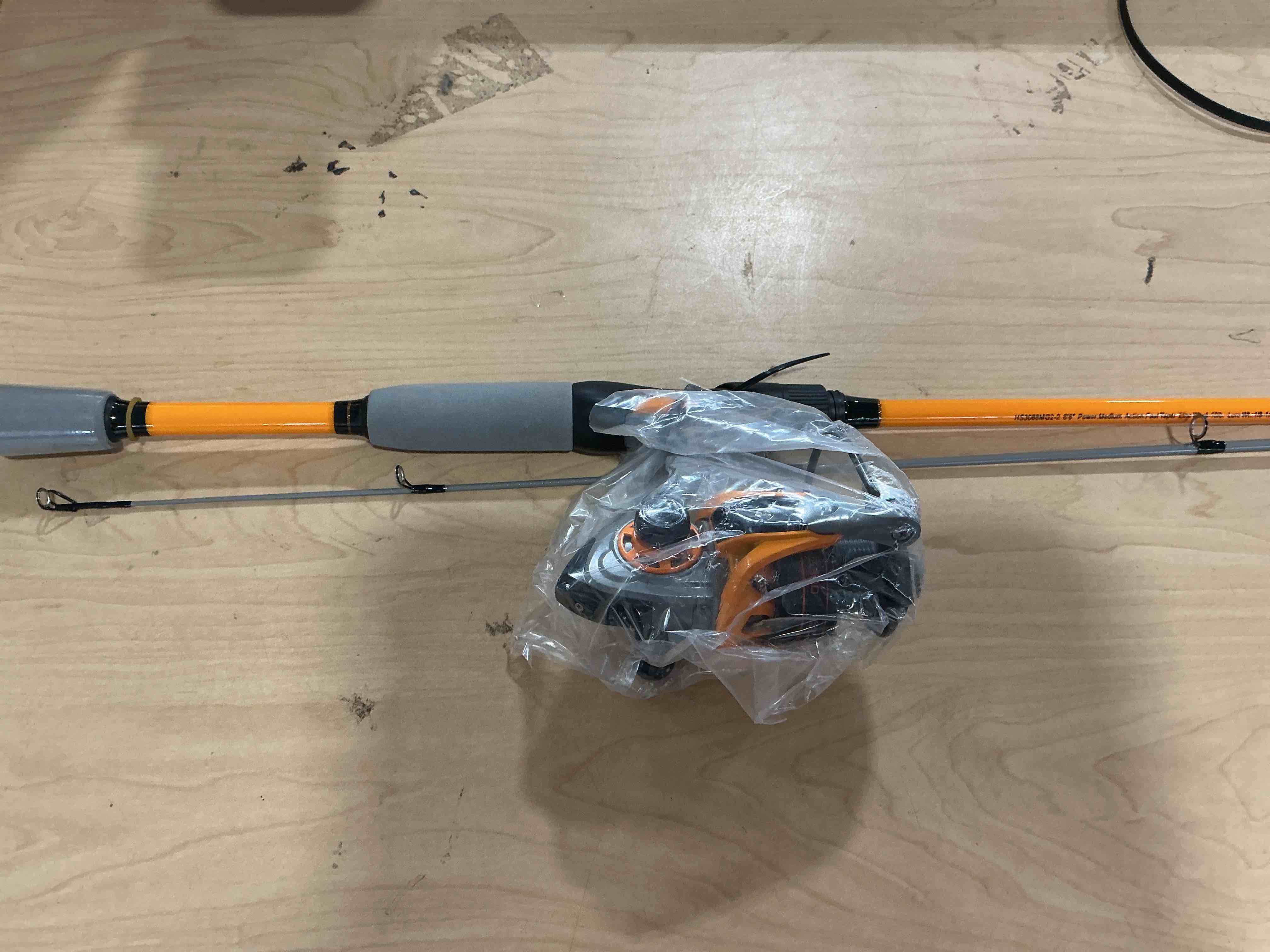 Condition photo showing New/Like New for lew’s hypersonic spinning reel and fishing rod combo, im6 graphite rod with fast action, 3+1 bearings, 5.1:1 gear ratio, speed lube, orange/gray 7'0"