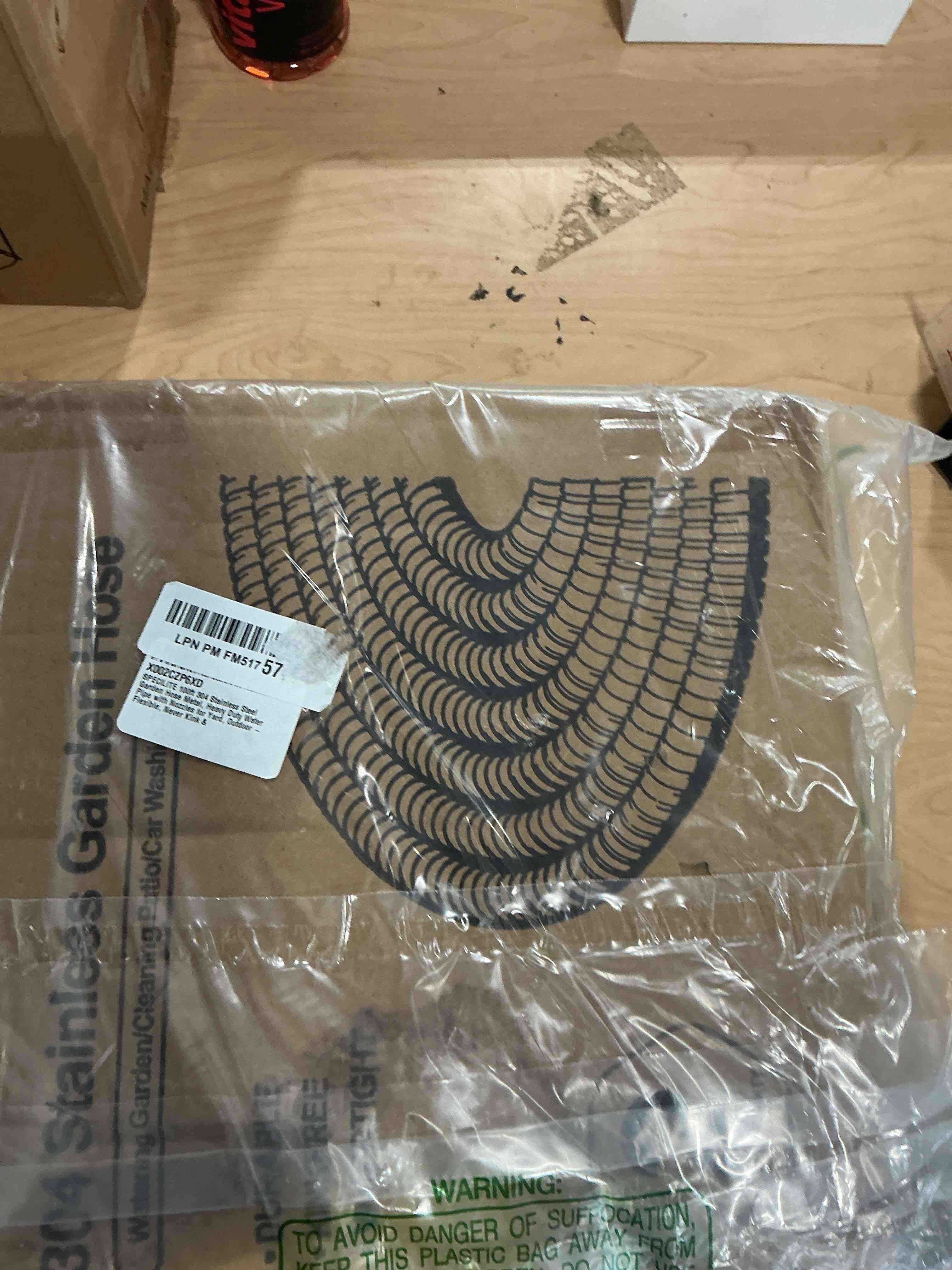 Condition photo showing New/Like New for specilite 100ft 304 stainless steel garden hose metal, heavy duty water pipe with nozzles for yard, outdoor - flexible, never kink & tangle, puncture resistant (sliver) 100ft sliver
