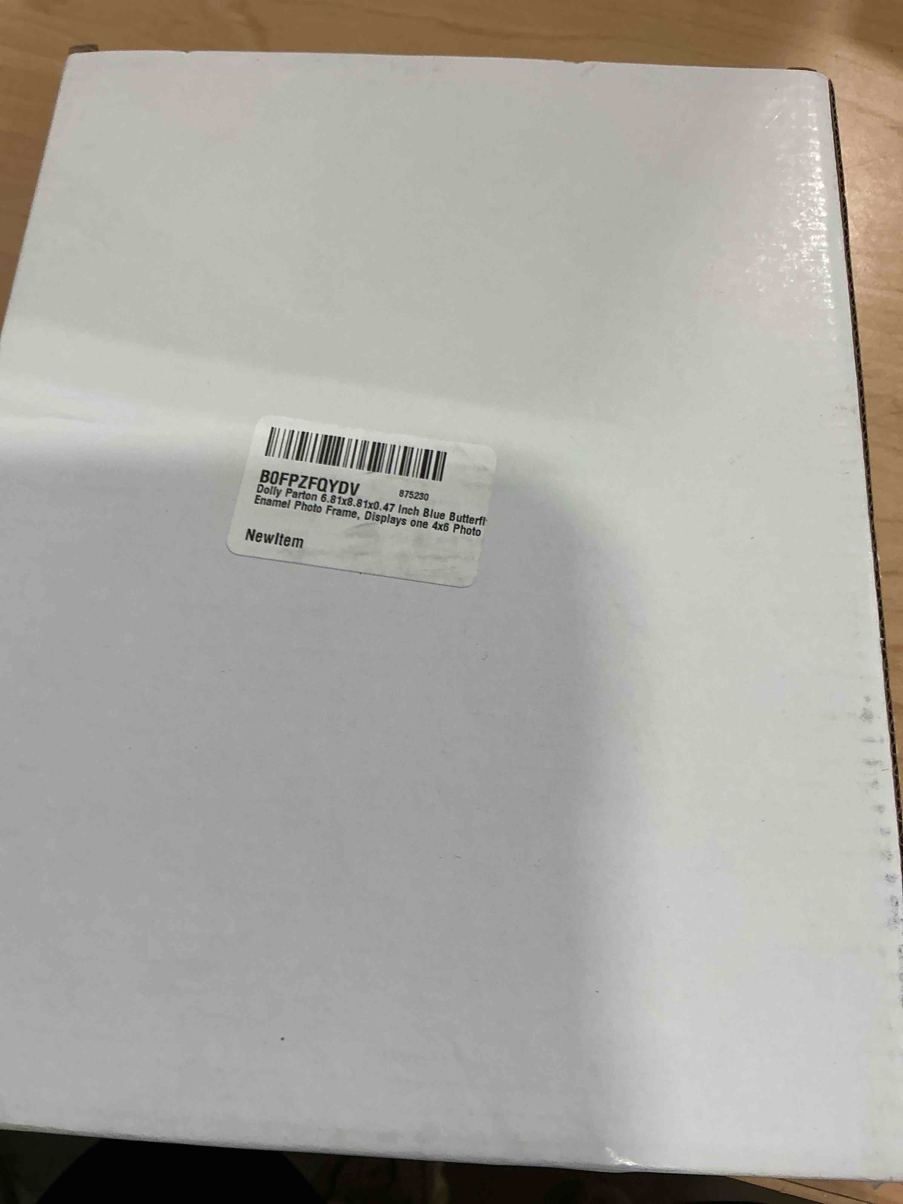 Condition photo showing Brand New for dolly parton 6.81x8.81x0.47 inch blue butterfly enamel photo frame, displays one 4x6 photo