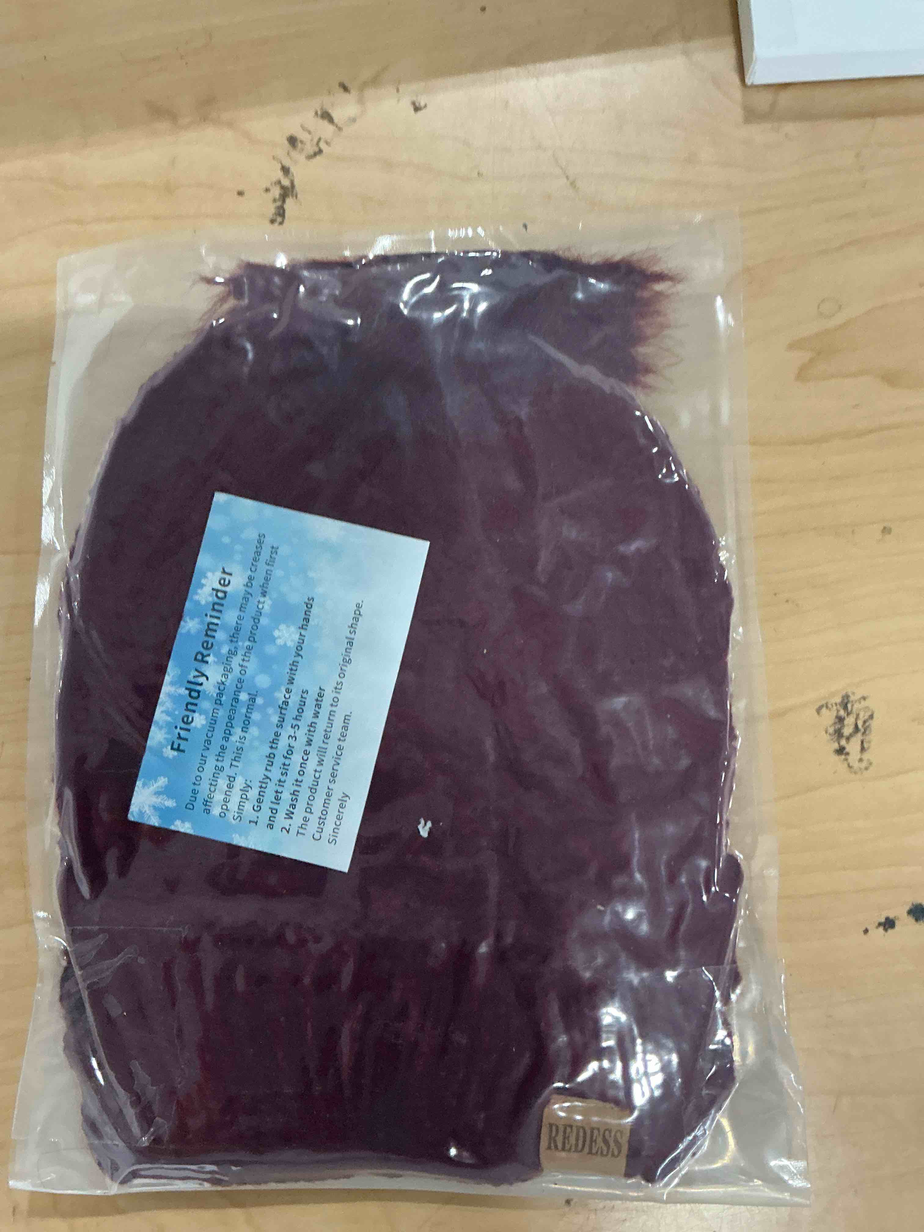 Condition photo showing New/Like New for redess women winter pom pom beanie hat with warm fleece lined wine red