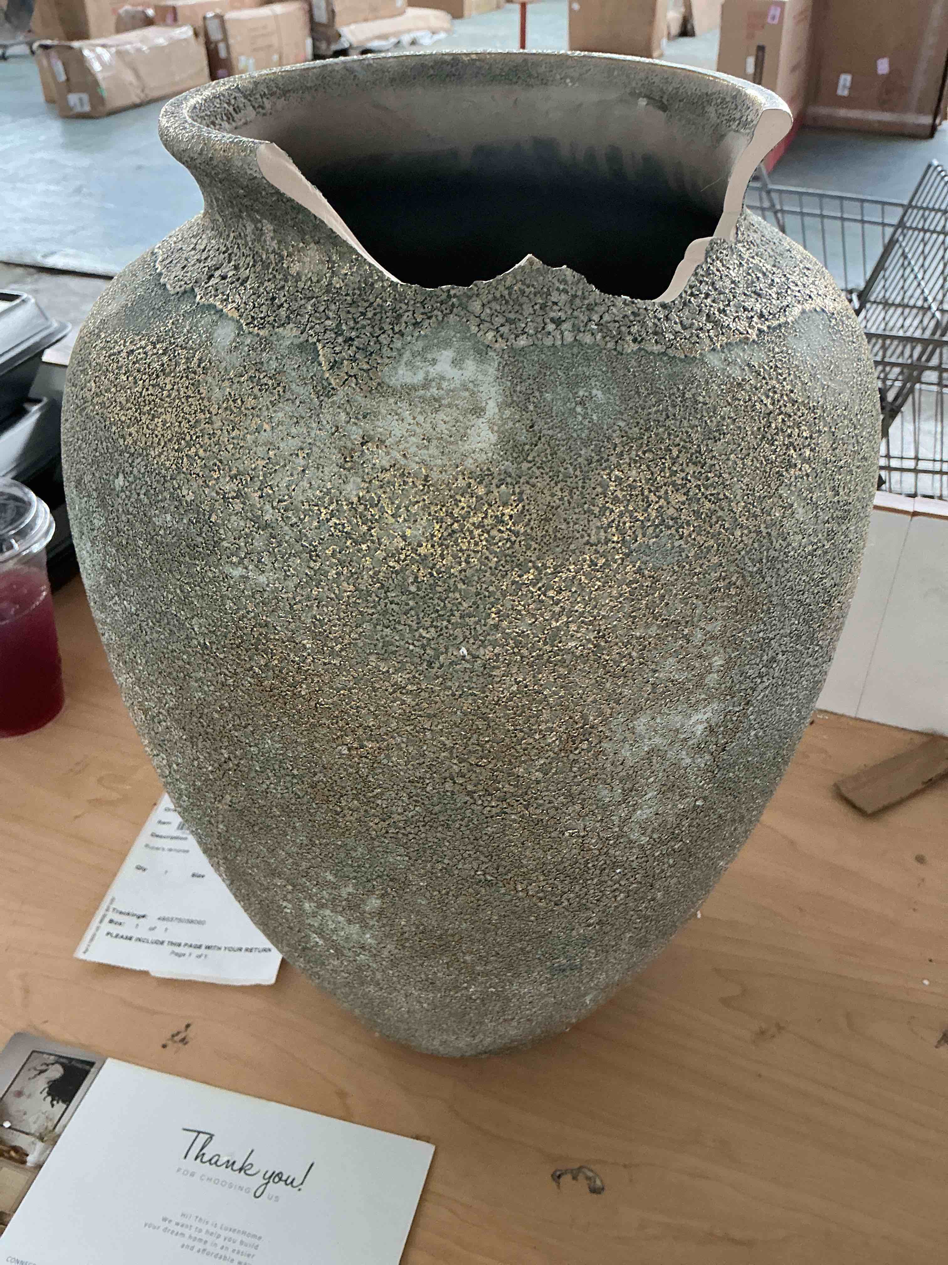 Condition photo showing As Is for rustic gold and brown terracotta tall urn vase 